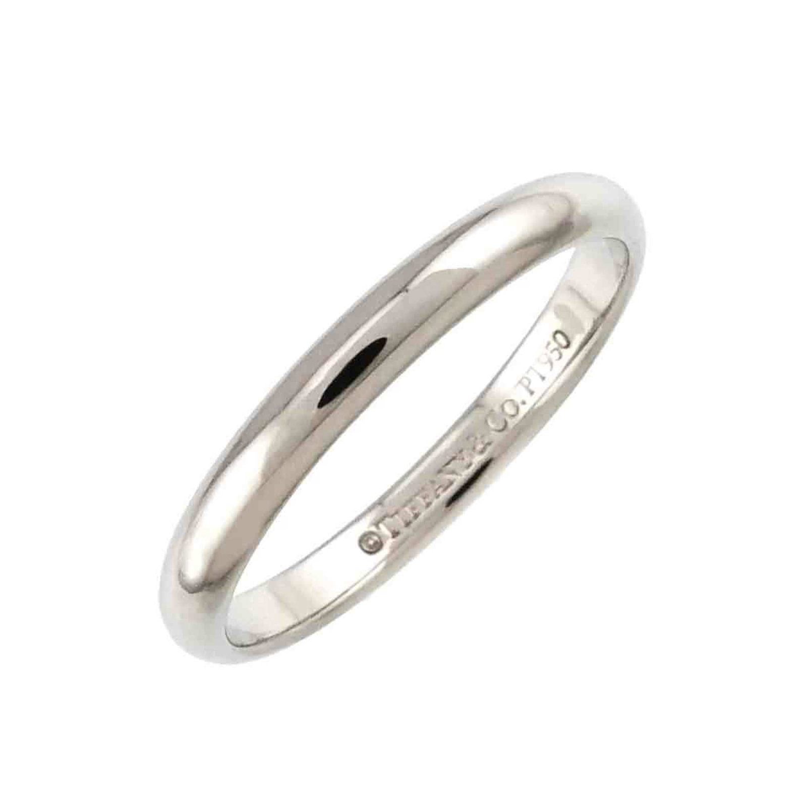 Platinum ring by Tiffany band: Platinum ring by Tiffany band Platinum ring by Tiffany features a silver band with a notable platinum material, available in US size 4. This like-new condition item shows hardly any traces of usage an