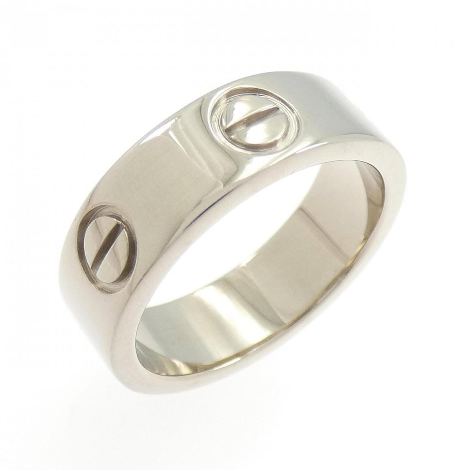 White Gold Cartier Band Ring 18K: White Gold Cartier Band Ring 18K White Gold Cartier Band Ring 18K features an 18k white gold construction, bearing the iconic Cartier brand. The ring's condition shows a few traces of usage, with