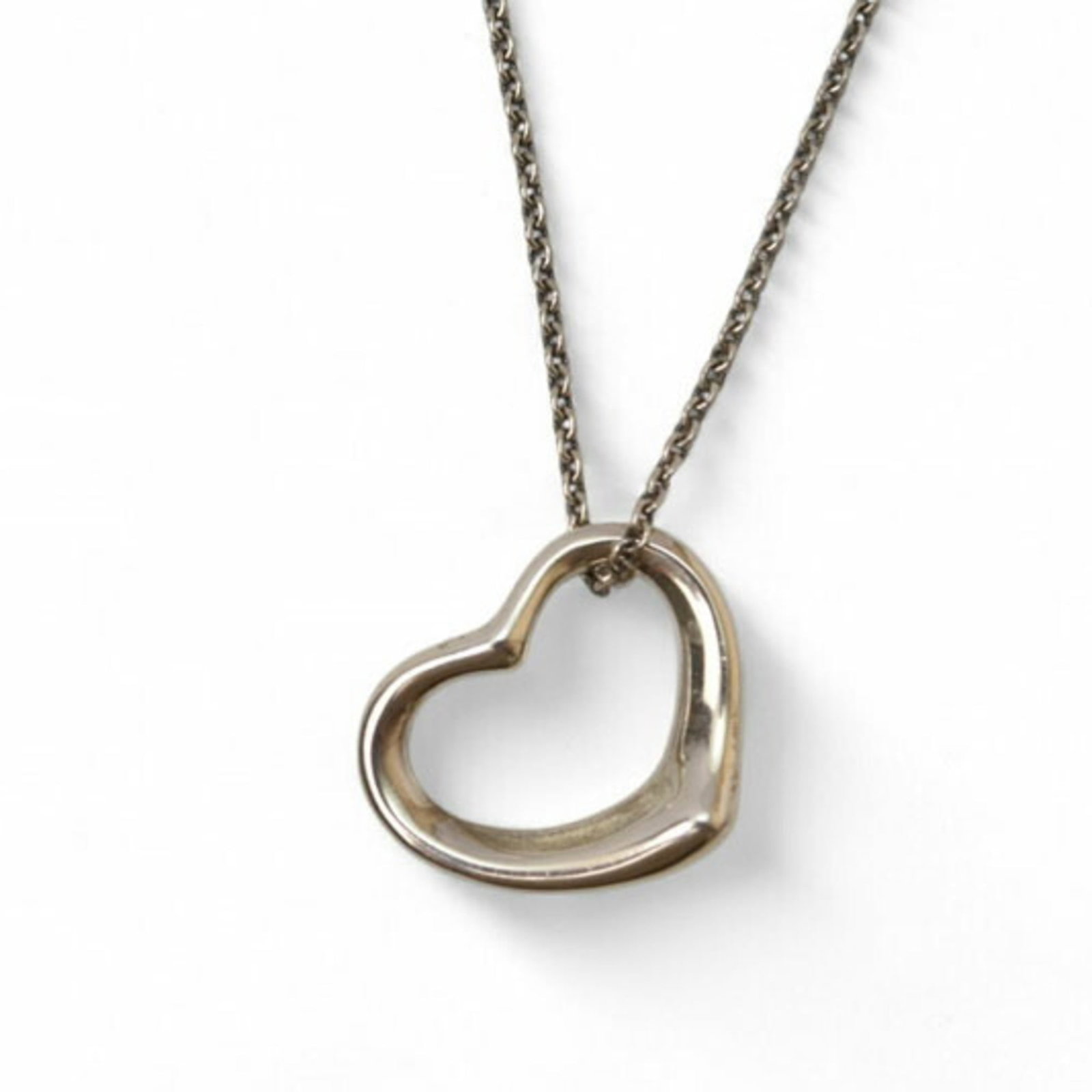 Elsa Peretti 1.5Cm Wide Silver Pendant Necklace Motif Heart by Tiffany: Elsa Peretti 1.5Cm Wide Silver Pendant Necklace Motif Heart by Tiffany Silver Pendant Necklace Motif Heart by Tiffany features a delicate, 1.5cm wide heart-shaped pendant in sterling silver (925). The