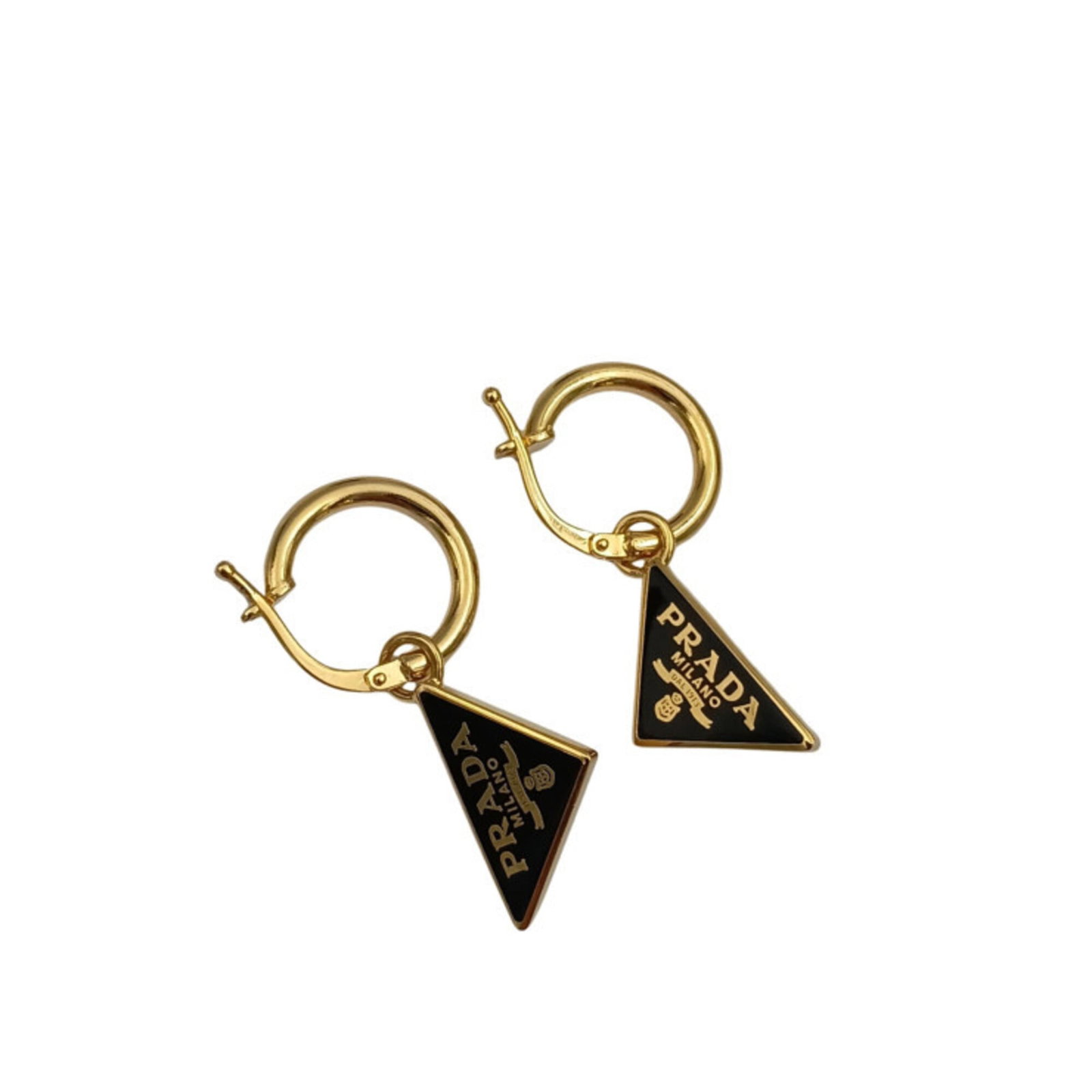 Metal Stud Earrings Prada: Metal Stud Earrings Prada Black and gold metal stud earrings from Prada, bearing minor traces of usage with some scratches and dirt. The condition is very good overall, reflecting a few signs of