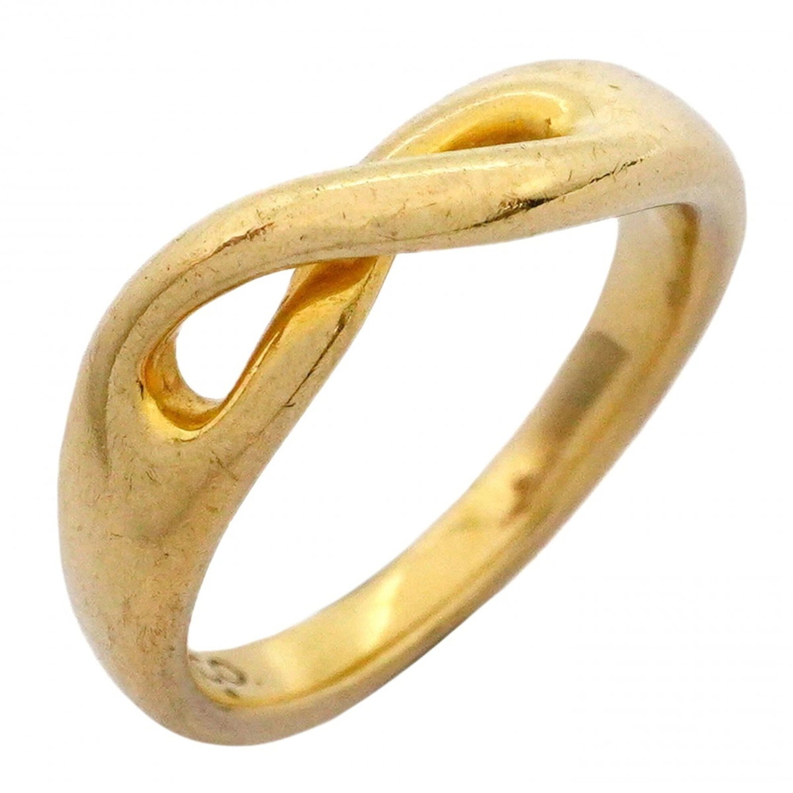 Tiffany Ring Gold Yellow 18K: Tiffany Ring Gold Yellow 18K This Tiffany ring features a stunning gold yellow 18K band, showcasing the brand's iconic style. The item bears traces of usage and minor scratches, but remains in good co