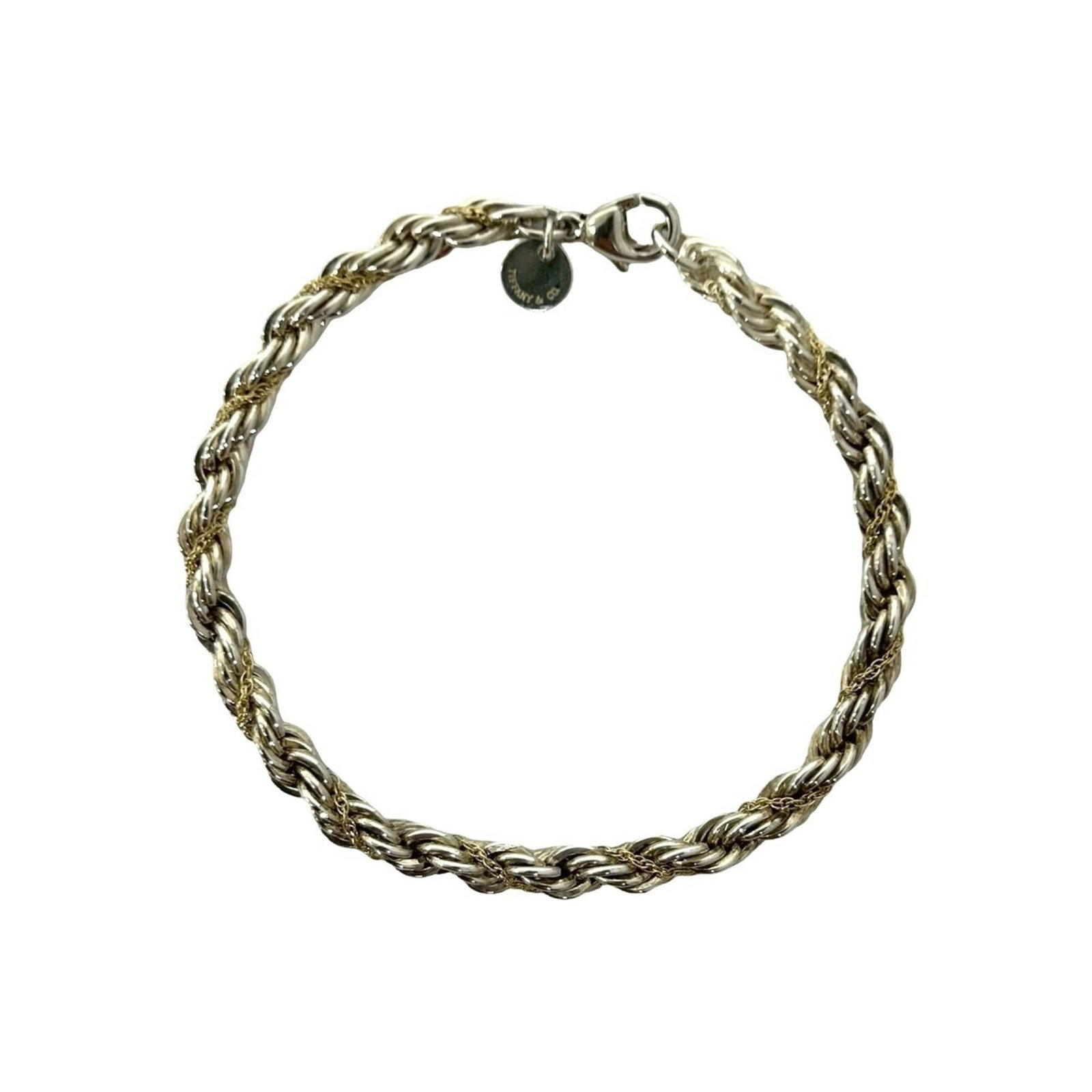 Tiffany Charm Bracelet Silver 925 Yellow Gold (18K): Tiffany Charm Bracelet Silver 925 Yellow Gold (18K) Silver and yellow gold combine in a timeless charm bracelet, crafted from 925 silver with an 18K yellow gold accent. The piece features a classic