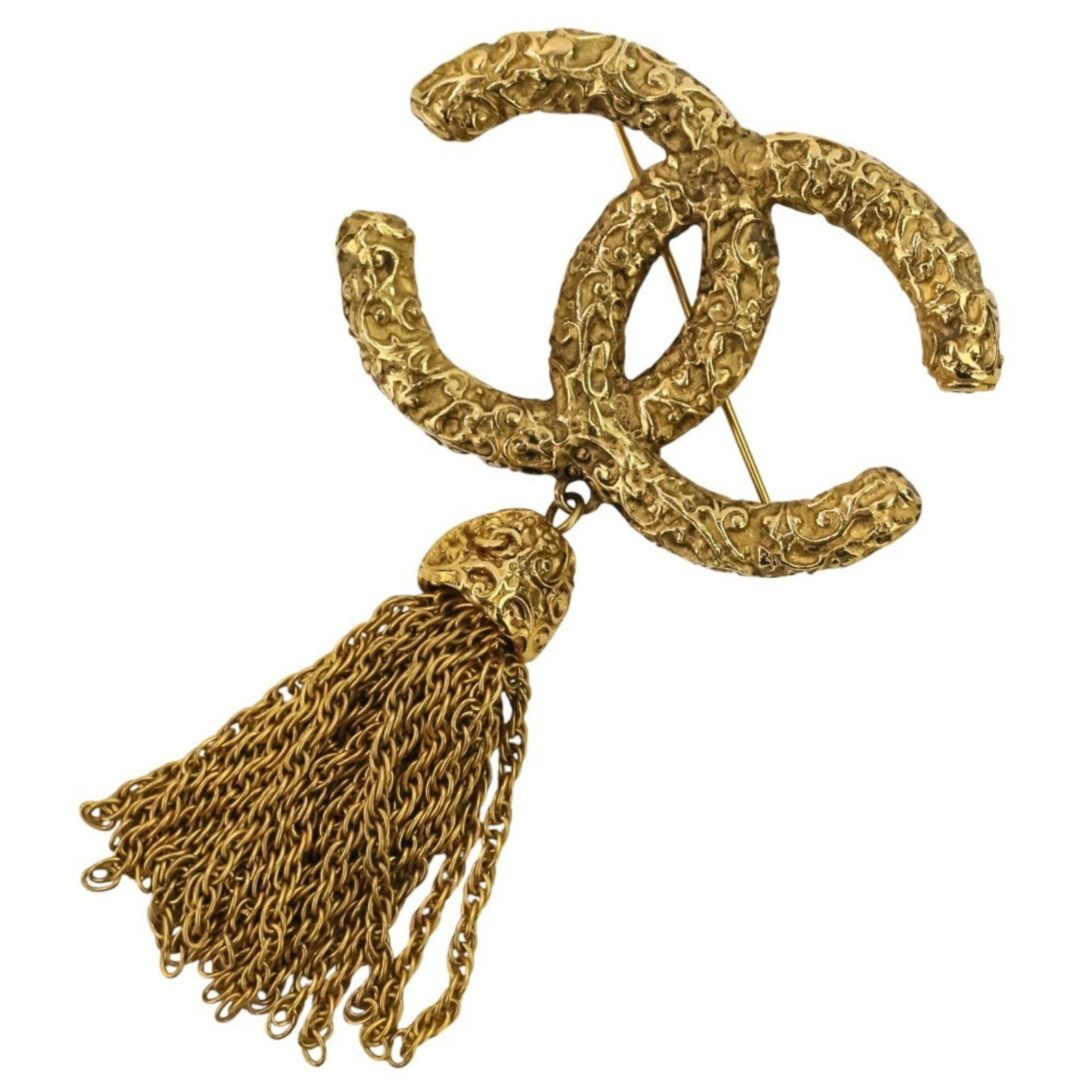 Brooch brass of Chanel: Brooch brass of Chanel This exquisite gold brass brooch from Chanel boasts a rich, sun-kissed finish and measures 3.6cm x 5.4cm in size, making it a stylish addition to any outfit. With hardly any