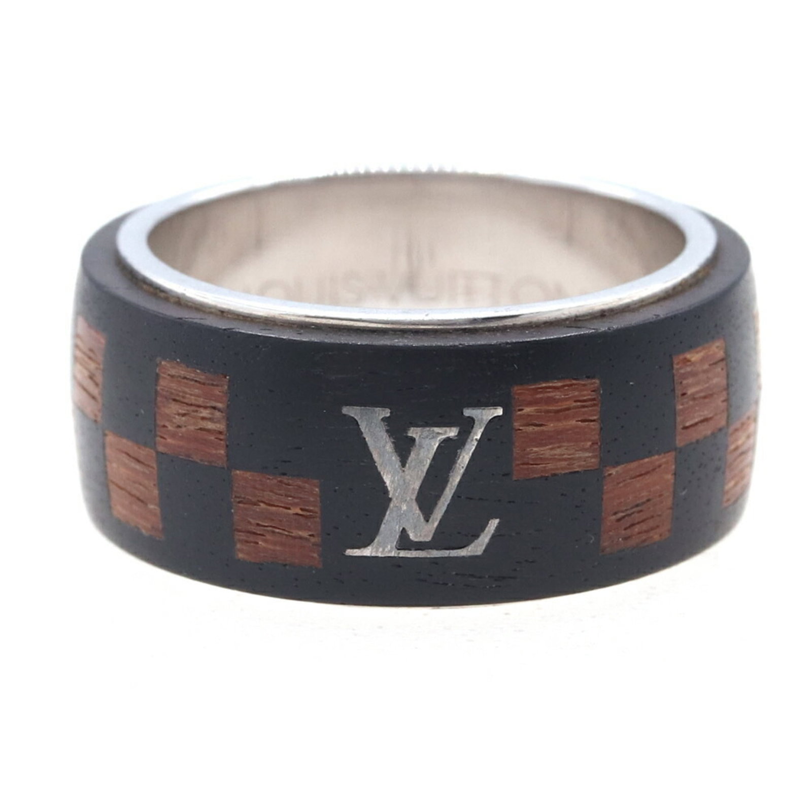 Louis Vuitton Band Ring Metal Wood: Louis Vuitton Band Ring Metal Wood Metal and wood come together in Louis Vuitton's Band Ring, a unique fusion of style and material. The ring bears traces of usage and shows minor scratches and dirt, 
