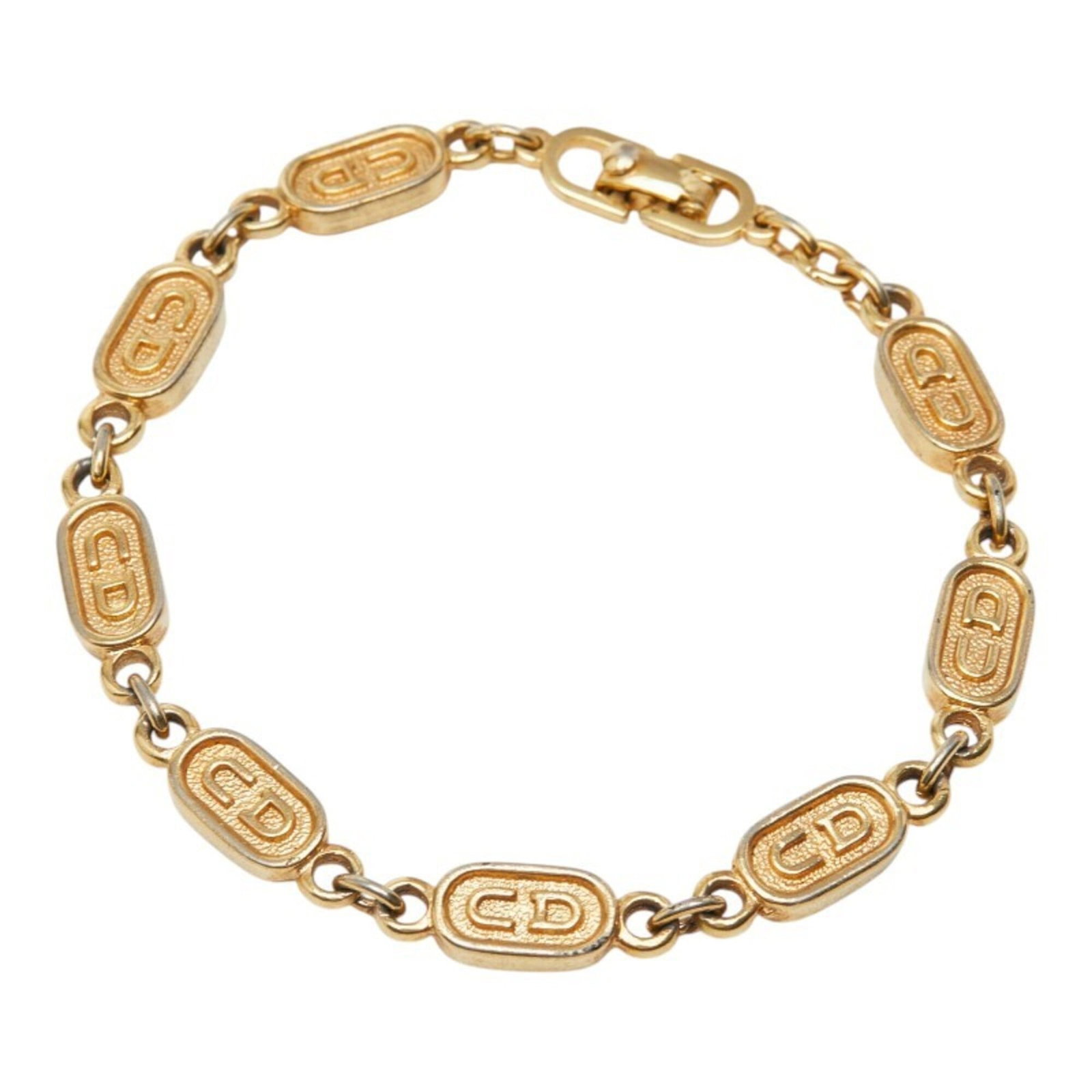 Christian Dior bracelet gold plating: Christian Dior bracelet gold plating Gold plating adds a touch of luxury to this Christian Dior charm bracelet, available in a sleek gold finish. Measuring 17.5cm in length, it features the iconic