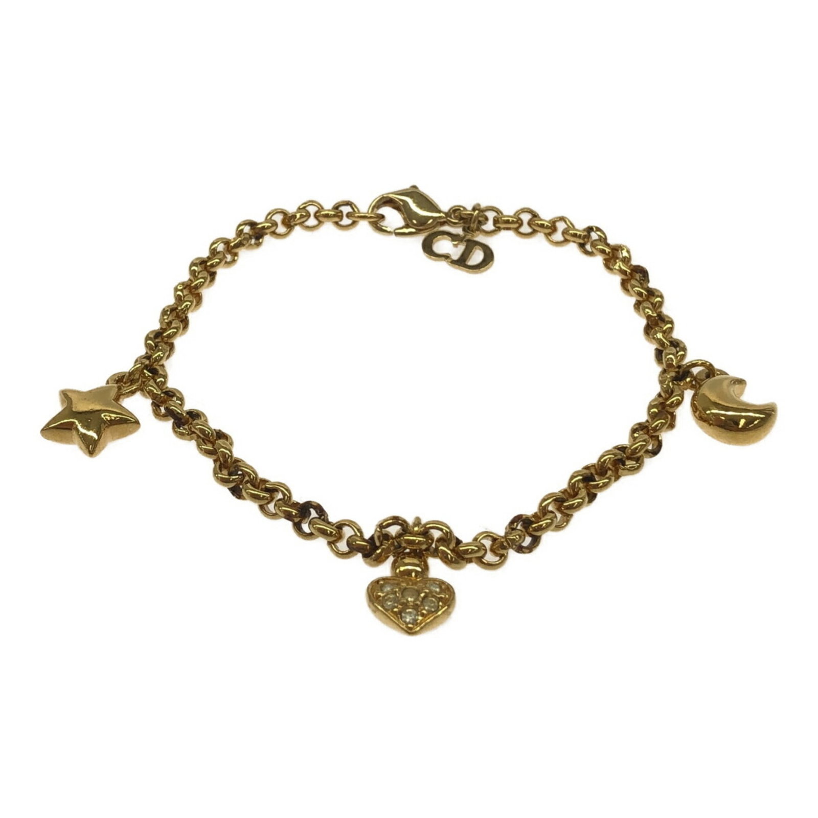 Dior Charm Christian: Dior Charm Christian Gold Charm Christian Dior bracelet with traces of usage and minor damages, still in acceptable condition for continued wear. This casual charm bracelet features a classic design