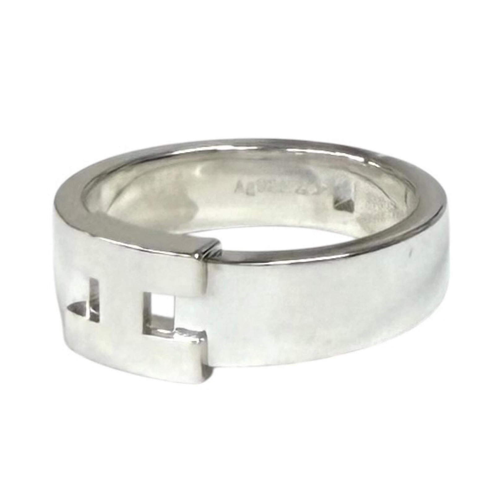 Ring Hermes Silver Band 925: Ring Hermes Silver Band 925 Silver band ring from Hermes featuring 925 sterling silver construction, with a width of 5mm and a weight of 5.17g. This piece bears the signature of its creator, bearing