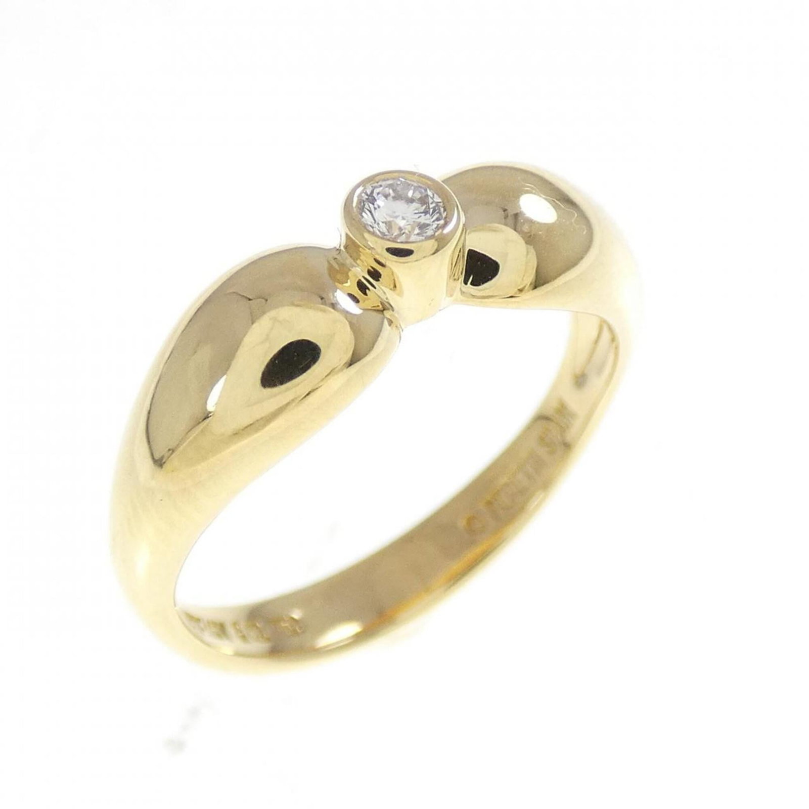 Tiffany Ring Gold Yellow 18K: Tiffany Ring Gold Yellow 18K Yellow gold 18K Tiffany band ring with a diamond stone, offering a touch of elegance to any outfit. The ring bears some signs of usage and minor scratches, but remains in 