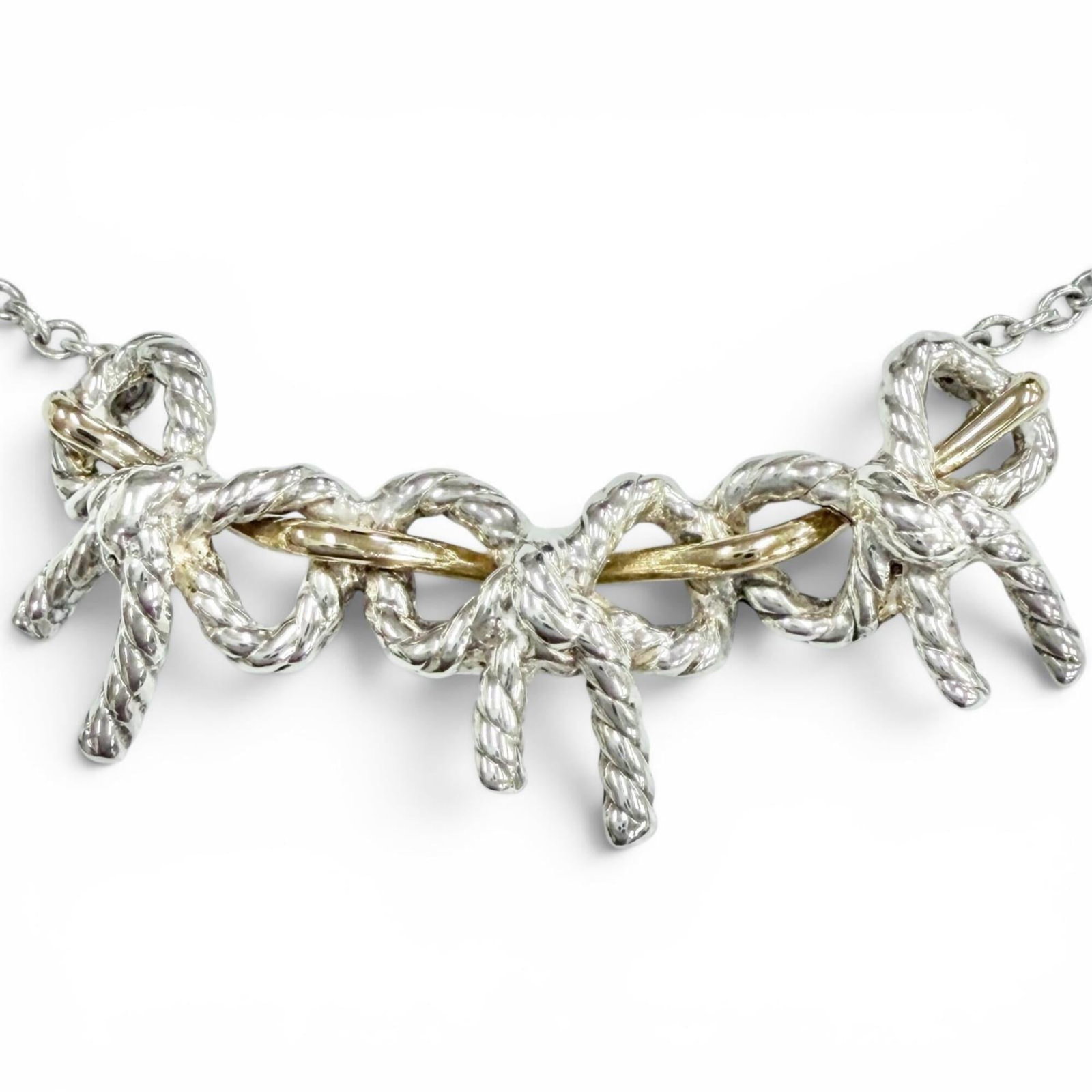 Tiffany&Co. Tiffany Triple Ribbon Combination Necklace 925/ 750 Sterling Silver And Gold Weight: Tiffany&Co. Tiffany Triple Ribbon Combination Necklace 925/ 750 Sterling Silver And Gold Weight Tiffany&Co.'s Tiffany Triple Ribbon Combination Necklace boasts a striking design featuring 925/750