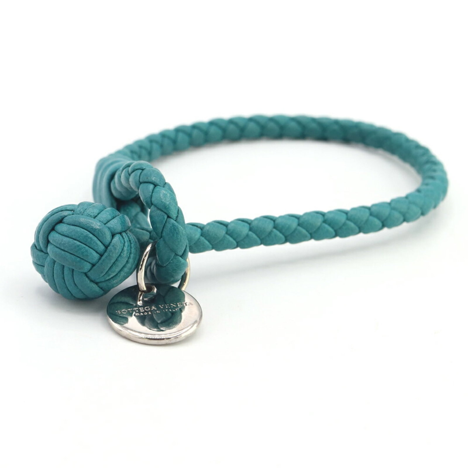 Charm Leather Bracelet Bottega: Charm Leather Bracelet Bottega Charm Leather Bracelet Bottega features a striking blue-green leather strap with intricate details, measuring 19cm in length. The 5mm wide bracelet boasts a 1.5cm x 1.5c