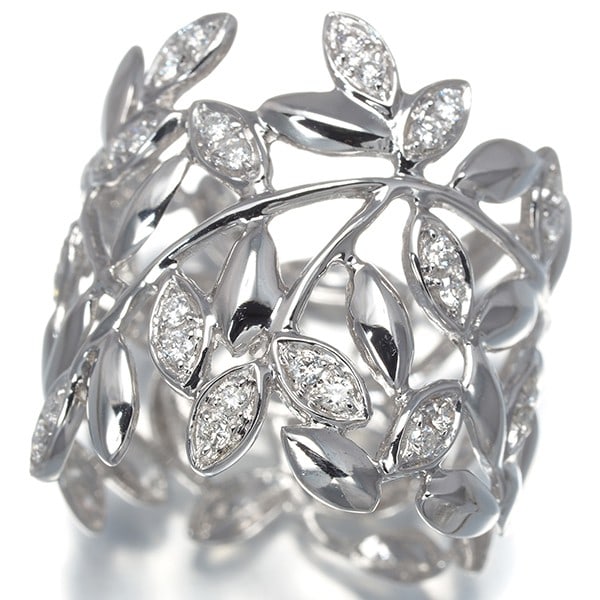 Diamond 0.40Ct Leaf Openwork Ring 18K 750 White Gold: Diamond 0.40Ct Leaf Openwork Ring 18K 750 White Gold 18k white gold wraps around the finger with elegance, supporting a stunning diamond at its center. The leaf openwork design adds a touch of