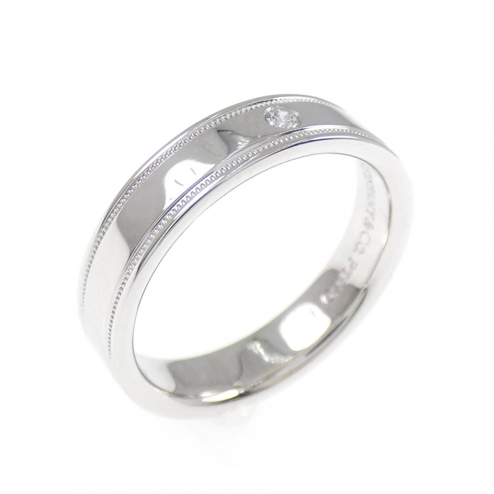 Double Milgrain Ring by Tiffany & Co: Double Milgrain Ring by Tiffany & Co Platinum double milgrain ring by Tiffany & Co, featuring intricate details and a classic design. The ring boasts a silver tone with subtle scratches and minor