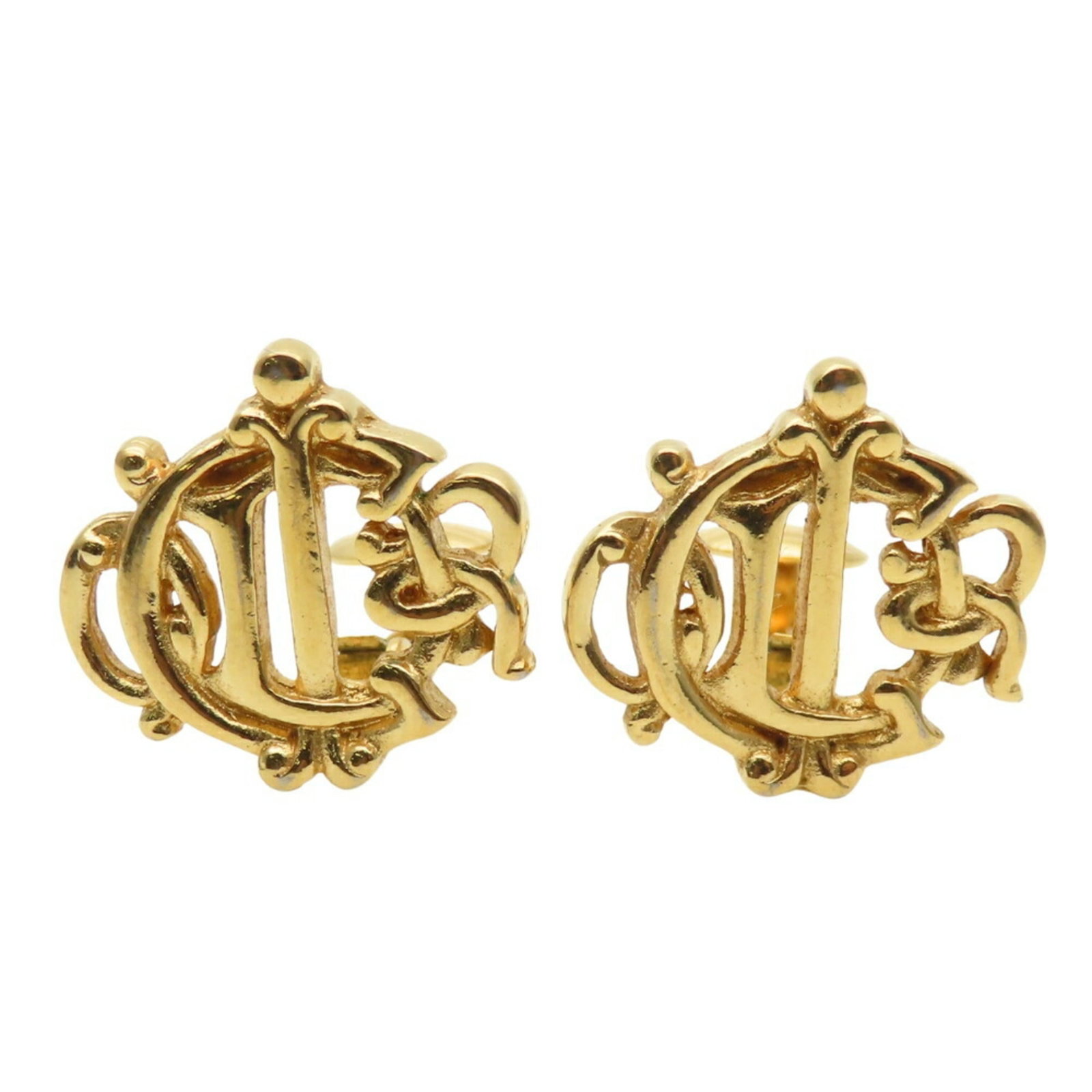 Metal clip earrings by Christian Dior: Metal clip earrings by Christian Dior Gold metal clip earrings by Christian Dior, featuring a sleek and sophisticated design. These earrings bear a signature, but the authenticity of the signature