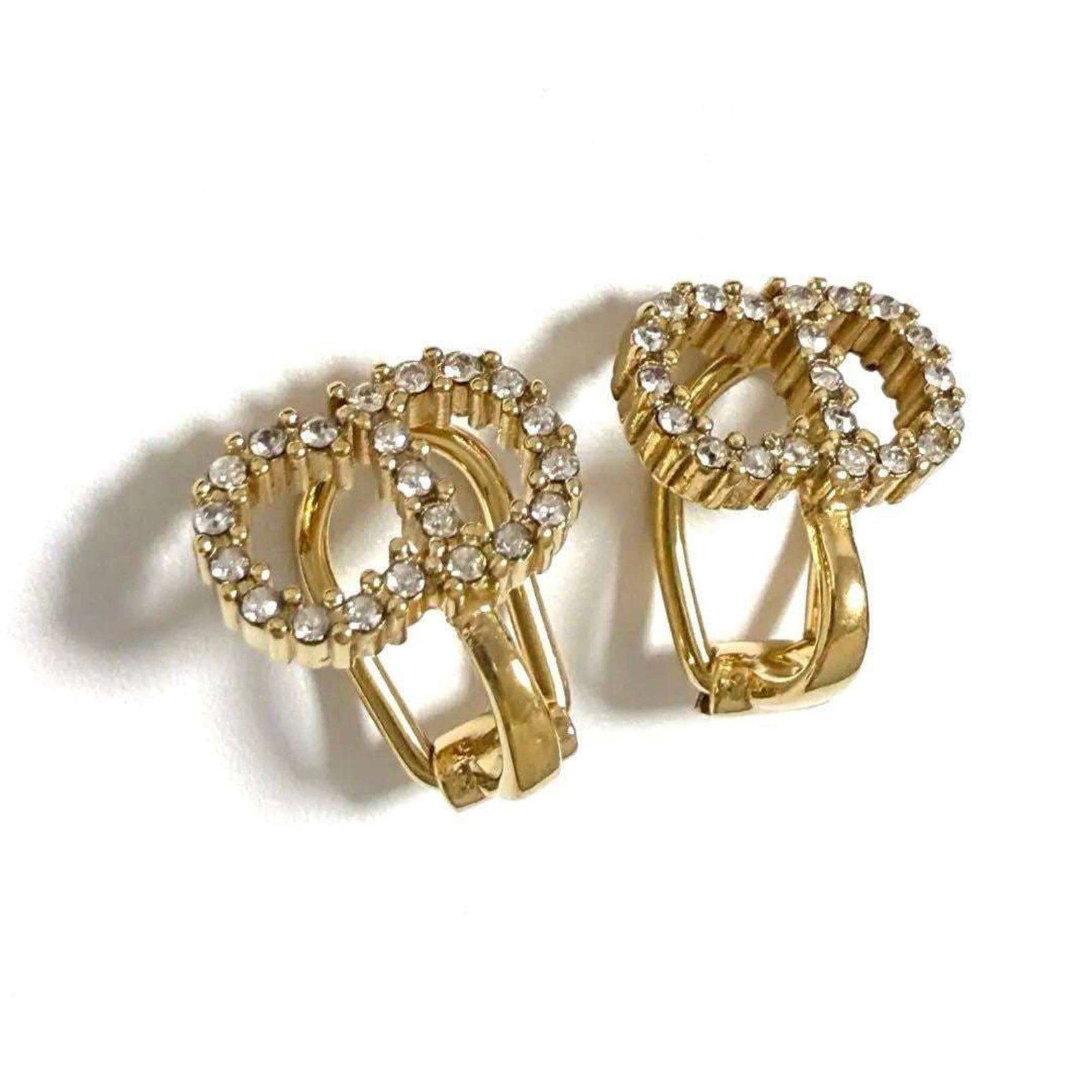 Metal Rhinestone Earrings Dior Clip Christian: Metal Rhinestone Earrings Dior Clip Christian Metal Rhinestone Earrings Dior Clip Christian are made from metal and feature rhinestones, with a clip design. They are in mint condition and come from th