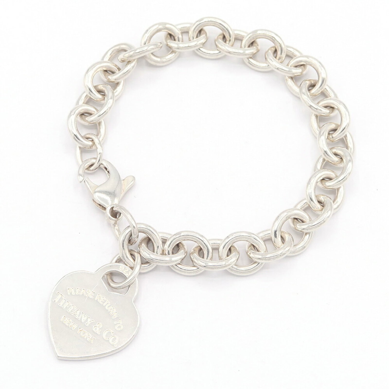 Silver 925 Tiffany Charm Bracelet: Silver 925 Tiffany Charm Bracelet Sterling silver 925 charm bracelet from Tiffany, featuring intricate details and a classic design. The 16.5cm length offers a comfortable fit, while the used conditio