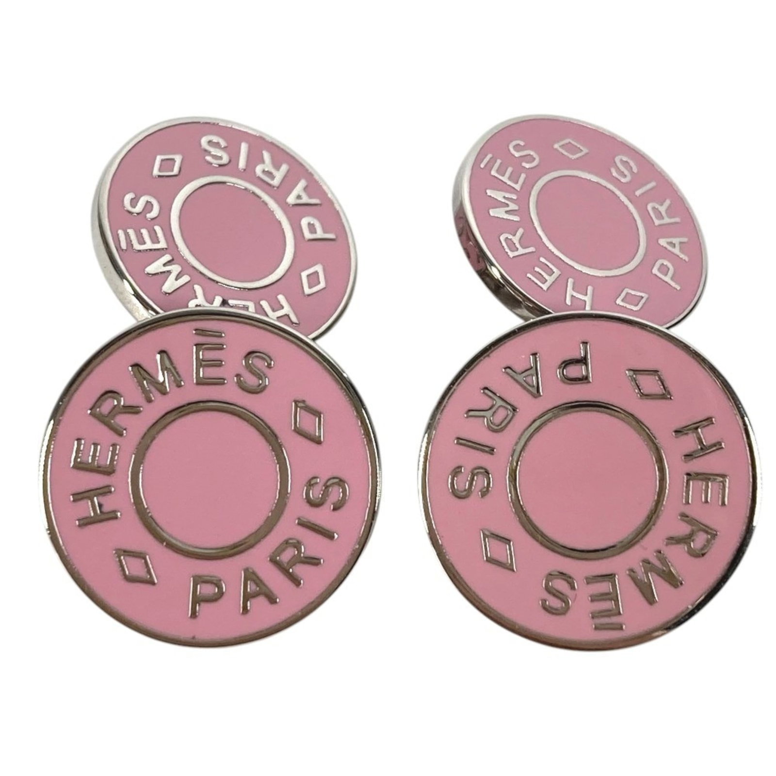 Metal cufflinks by Hermes: Metal cufflinks by Hermes Pink and silver metal cufflinks by Hermes, bearing traces of usage and minor scratches. The item's condition reflects its used state, with visible signs of wear and dirt accu