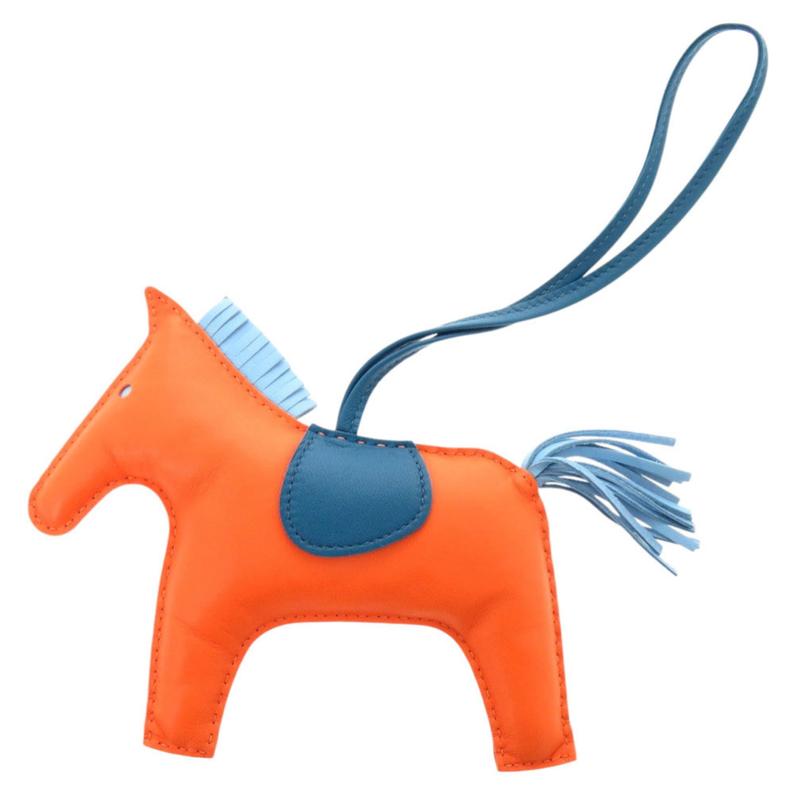 Hermes Handbag Charm Agneau Milo: Hermes Handbag Charm Agneau Milo Agneau Milo charm from the iconic Hermes handbag collection, featuring a striking blue, feu, and orange color scheme. This used charm boasts a unique design with some