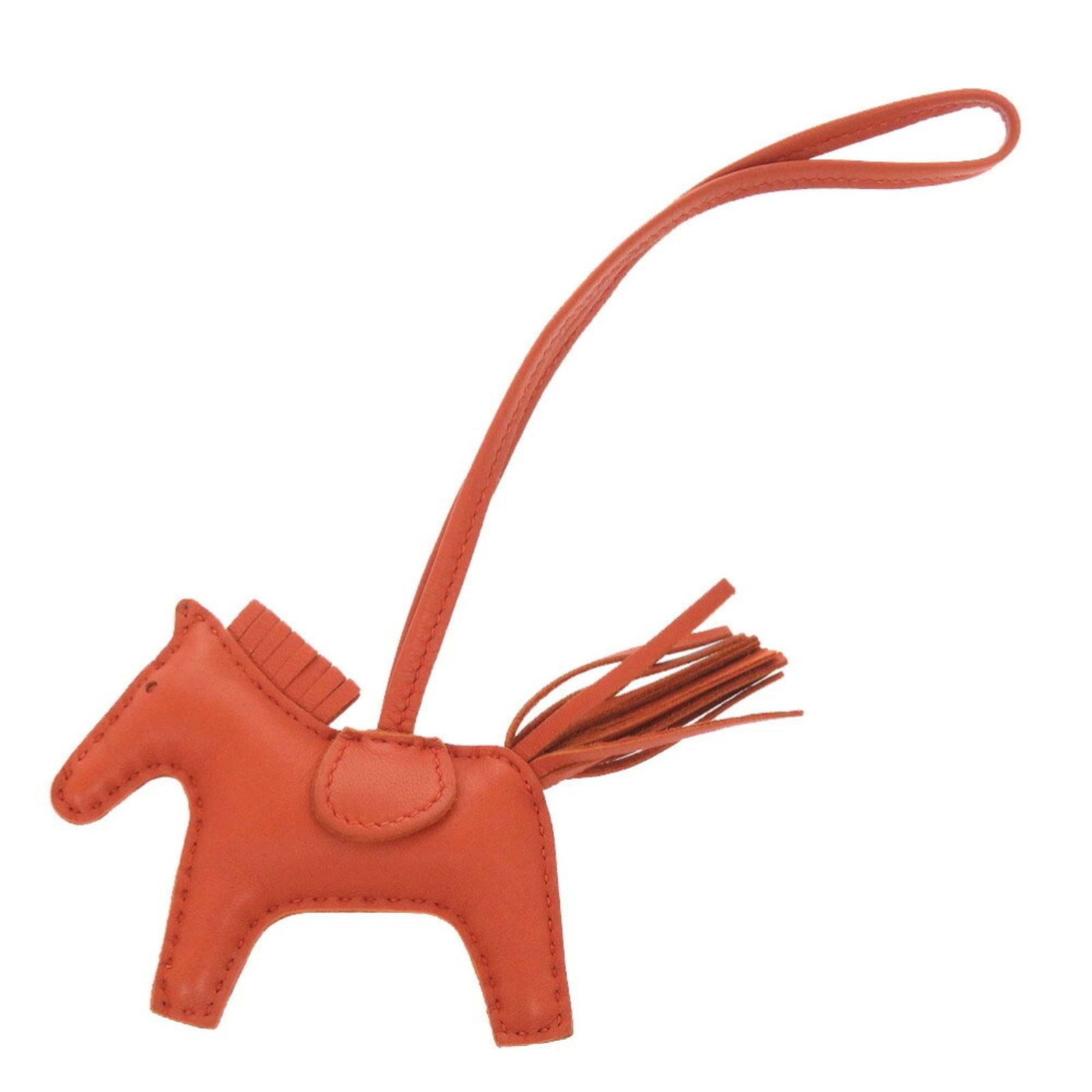 Hermes Handbag Charm Agneau Milo: Hermes Handbag Charm Agneau Milo Agneau Milo, the iconic Herm?s handbag charm, adds a pop of vibrant red to any accessory. With its sleek design and durable construction, this charming piece is sure