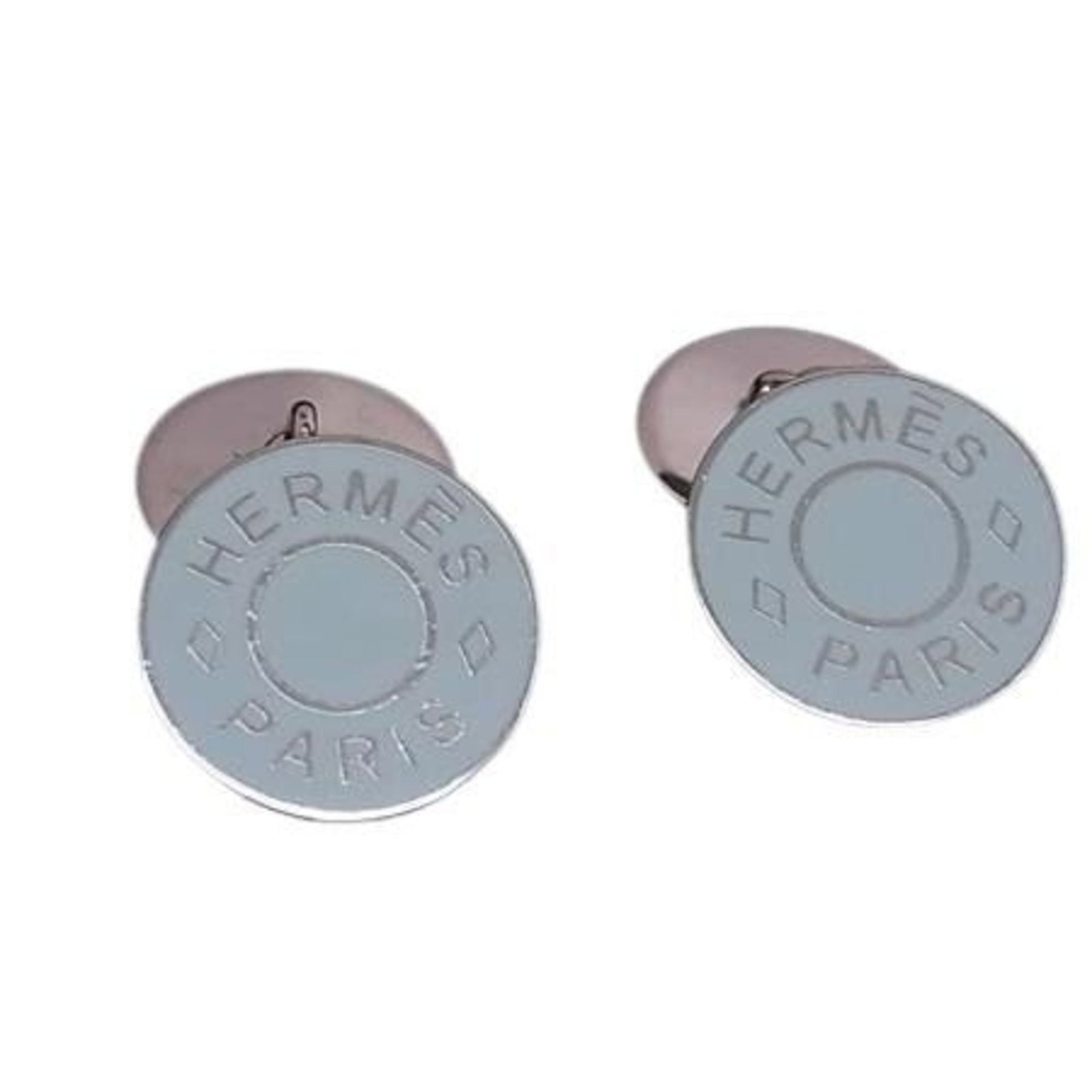 Button Metal by Hermes Stud: Button Metal by Hermes Stud Light blue button metal by Hermes Stud, measuring 1.40mm x 1.40mm, bears minor traces of usage with some scratches and dirt visible in a very good condition. The stud's lig