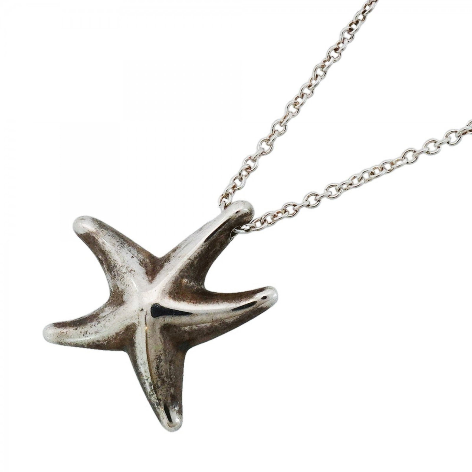 Sterling silver starfish necklace for women by Tiffany & Co.: Sterling silver starfish necklace for women by Tiffany & Co. Sterling silver starfish necklace for women by Tiffany & Co. features a 15mm x 14.3mm pendant with a 41 cm / 16.14'' adjustable neck circum