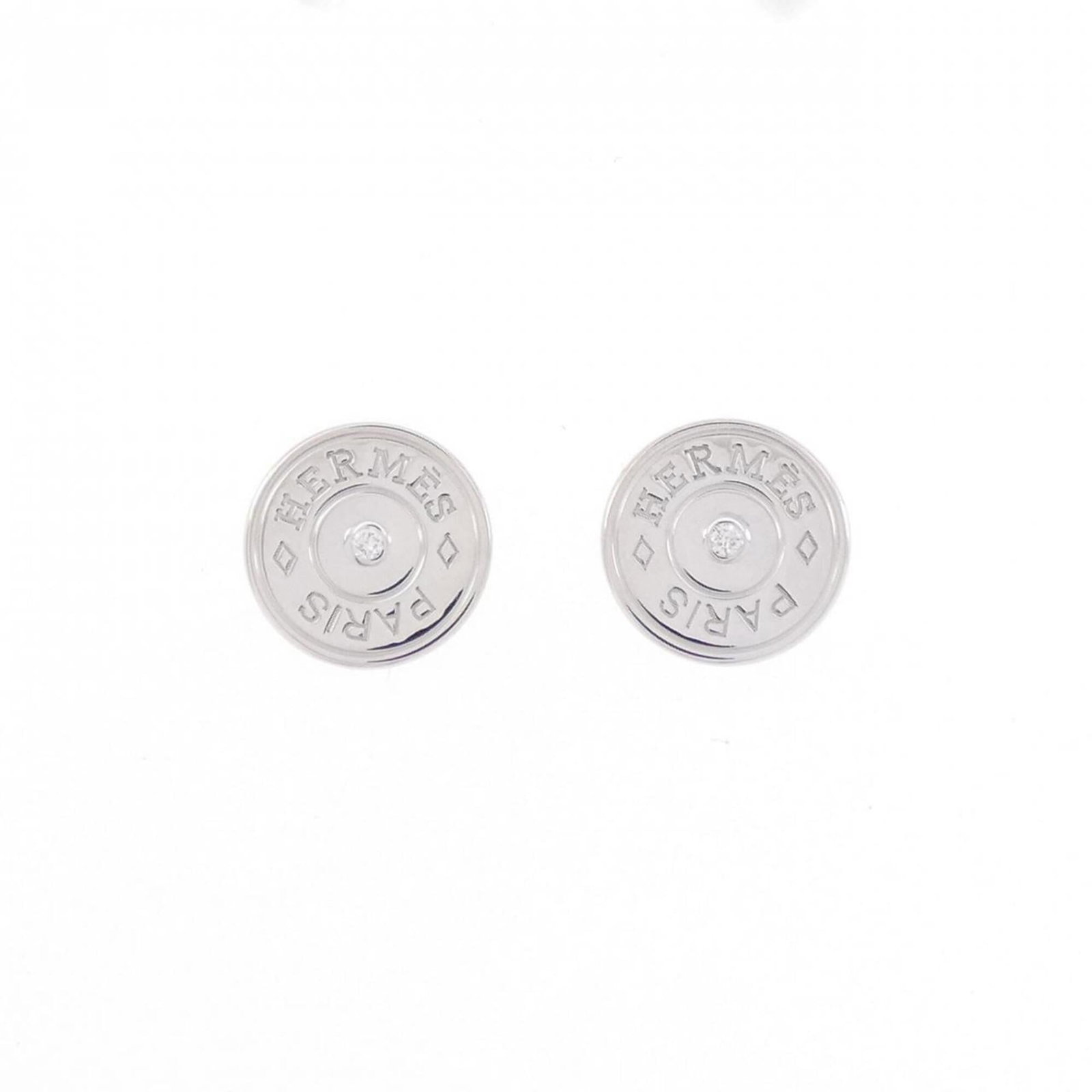 Hermes Stud Earrings White Gold (18K): Hermes Stud Earrings White Gold (18K) Stud earrings featuring a 9.90mm x 9.90mm diamond set in white gold (18K). Made from high-quality white gold, these earrings showcase a subtle elegance with