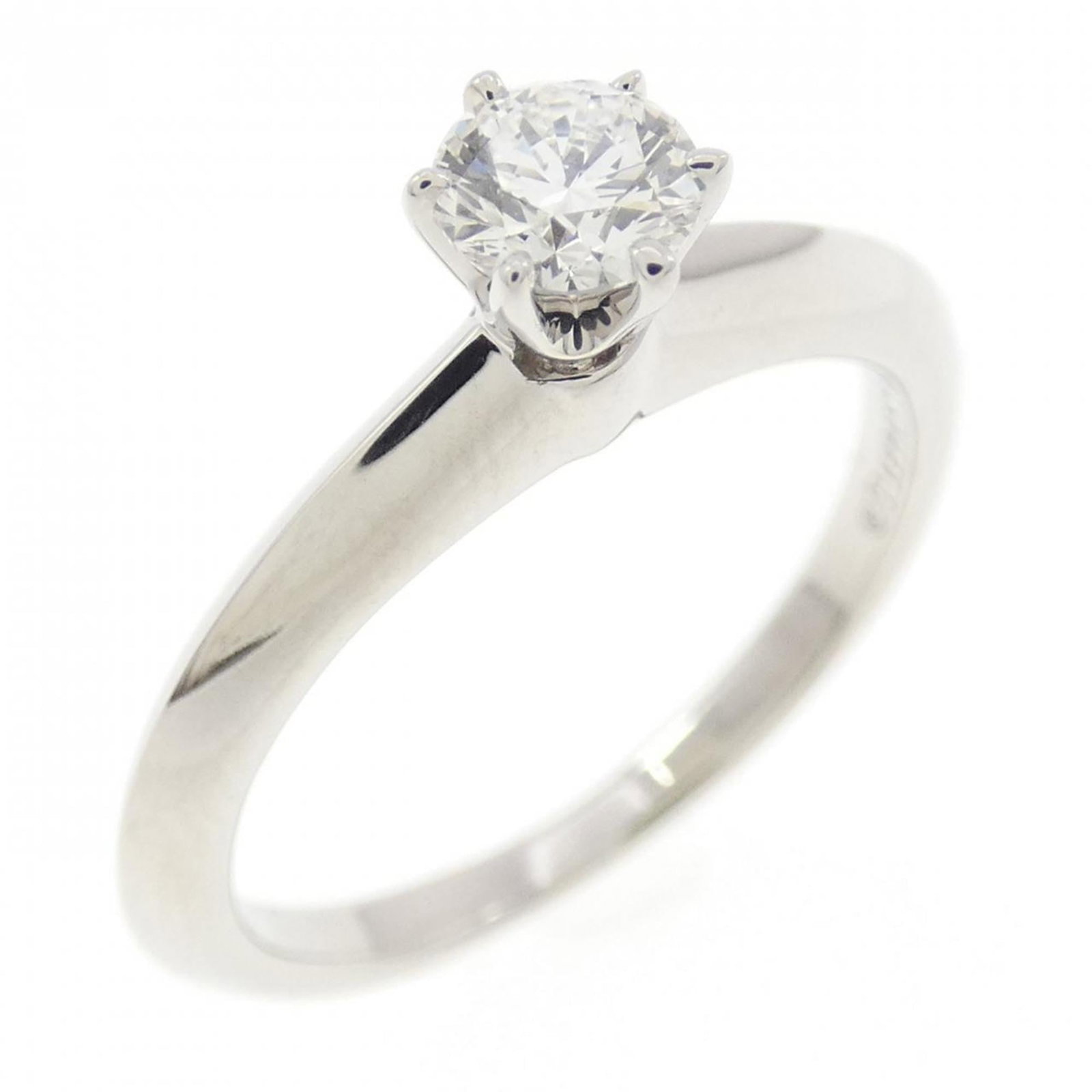 Platinum ring by Tiffany band: Platinum ring by Tiffany band Platinum ring by Tiffany features a diamond stone weighing 0.21 carats, set in a band style ring with a US size of 3.5. The item is made from platinum and bears some sign