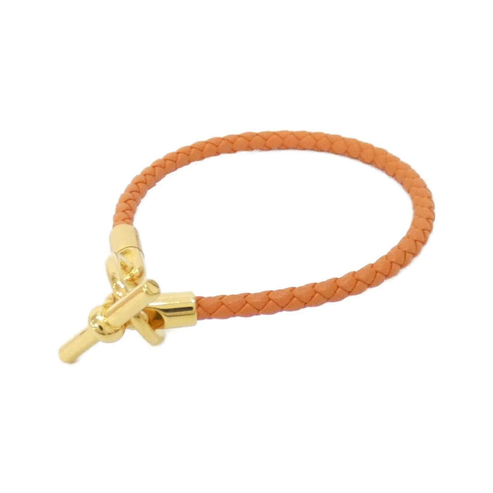Hermes Leather Charm Swift Bracelet: Hermes Leather Charm Swift Bracelet Swift Leather Charm Bracelet from Hermes boasts vibrant orange color and sleek design, adding a pop of personality to any outfit. Made from high-quality swift