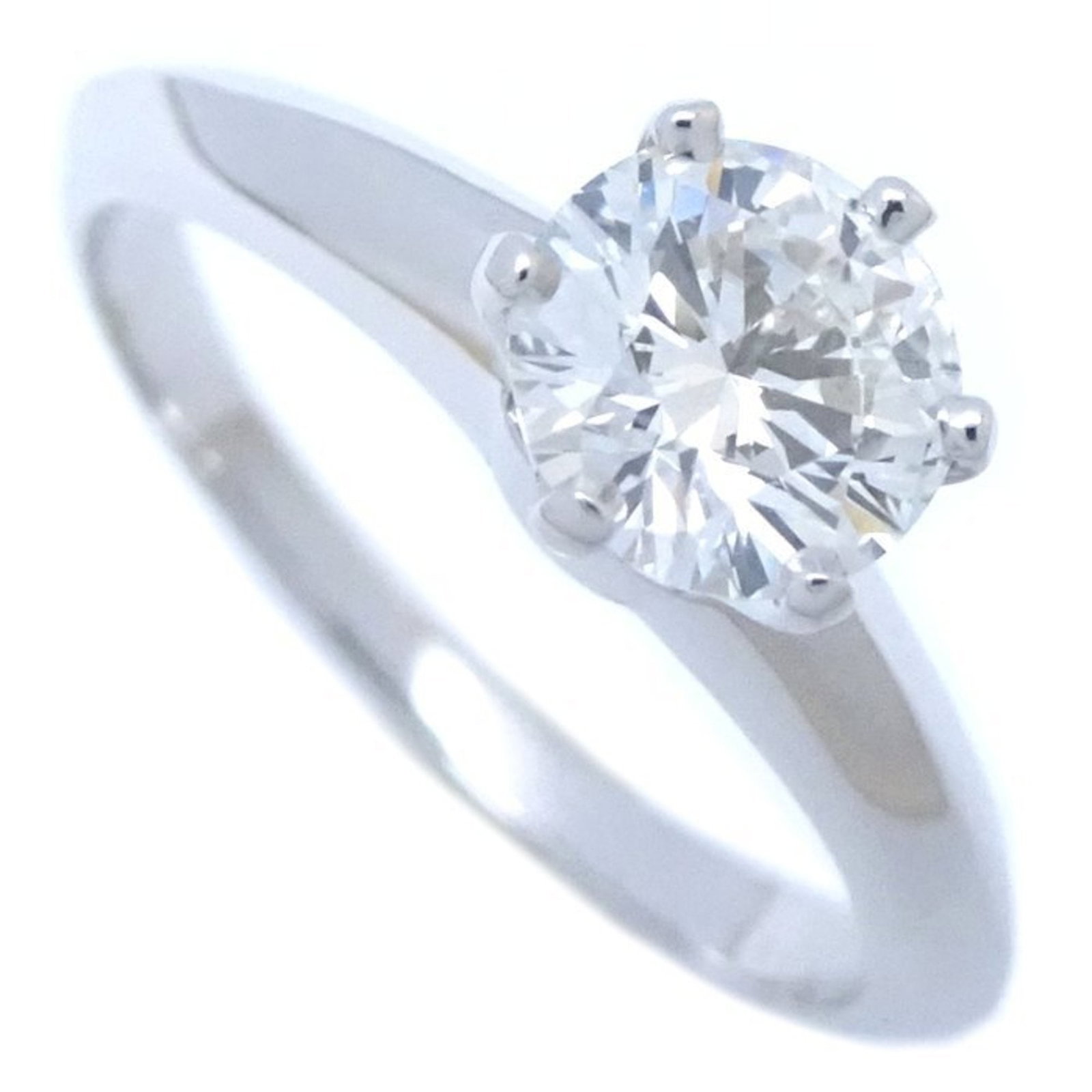 Platinum ring by Tiffany band: Platinum ring by Tiffany band Platinum ring by Tiffany & Co. features a diamond stone weighing 0.60 carats, graded H in color and Vvs1 in clarity. Made from high-quality platinum, this band ring boast
