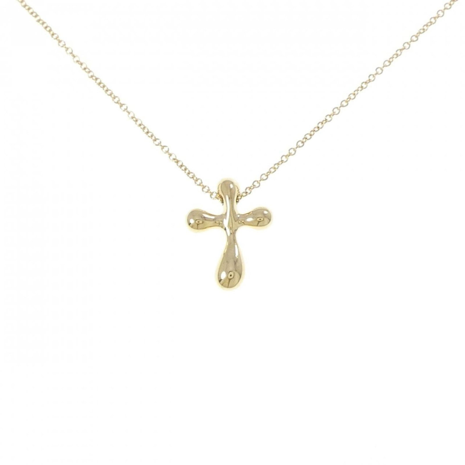 Cross Necklace by Tiffany: Cross Necklace by Tiffany Yellow Gold (18K) Cross Necklace by Tiffany, 41 cm / 16.14'' circumference, featuring a 15.9mm x 12.2mm pendant with a subtle yellow gold finish, bearing a signature. A
