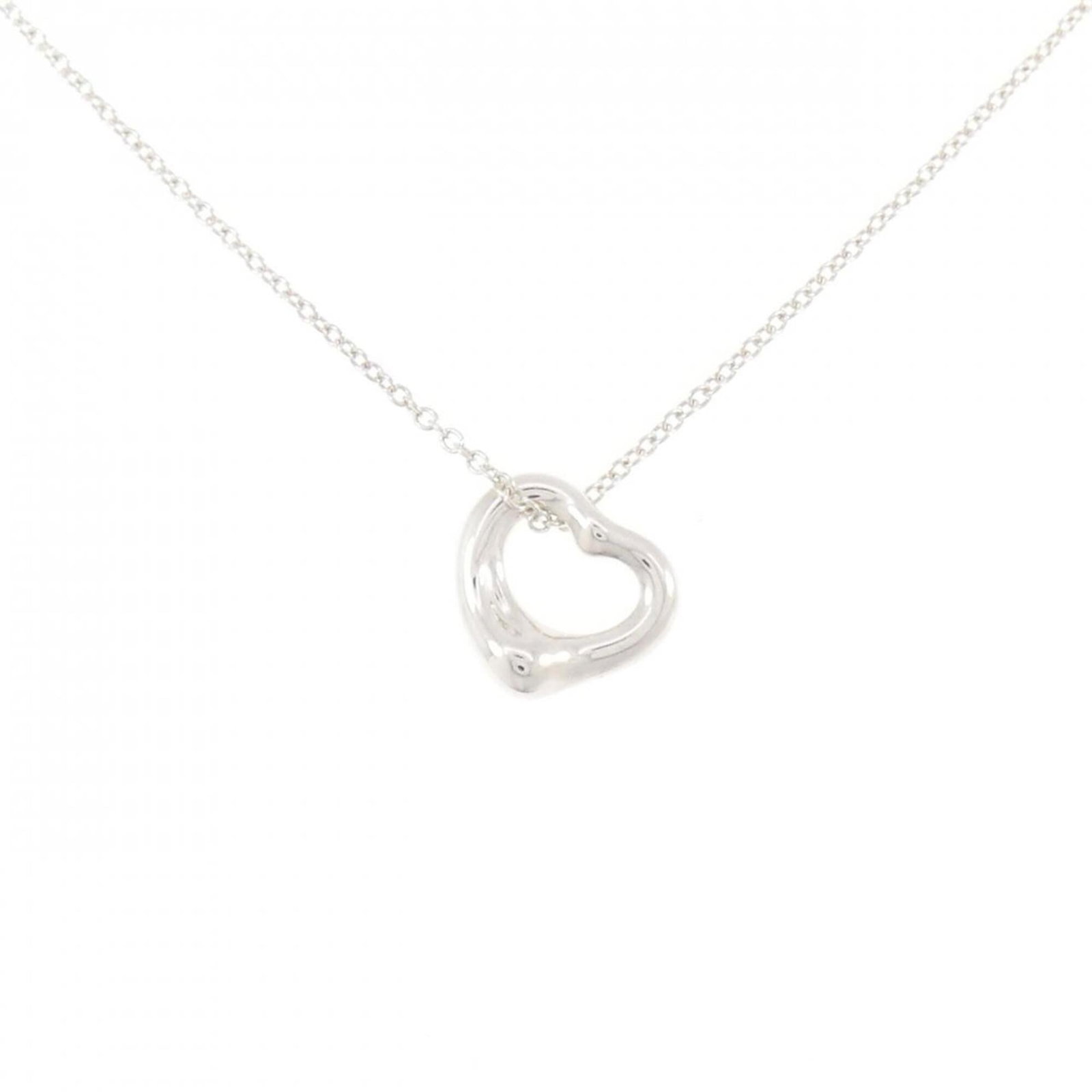 Heart Open Tiffany Necklace: Heart Open Tiffany Necklace A Tiffany Necklace featuring a Heart Open pendant in sterling silver, measuring 10.7mm x 10.7mm, with a 41 cm / 16.14'' adjustable neck circumference. The necklace is made 