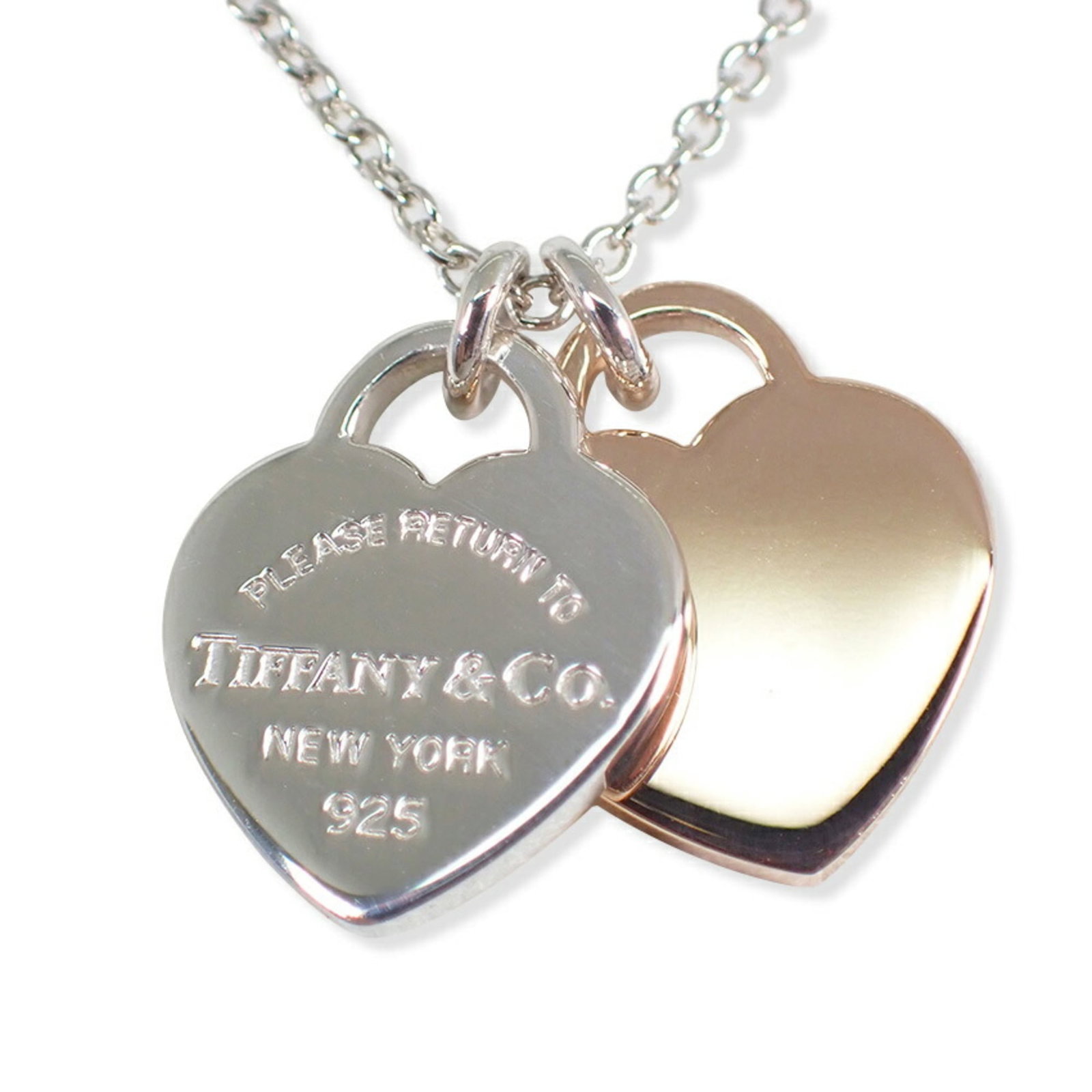 Tiffany & Co. 925 Rubedo Metal Return To Tiffany Double Heart Tag Pendant: Tiffany & Co. 925 Rubedo Metal Return To Tiffany Double Heart Tag Pendant Sterling silver pendant with a Return To Tiffany double heart tag, crafted from 925 Rubedo metal. This elegant piece features 