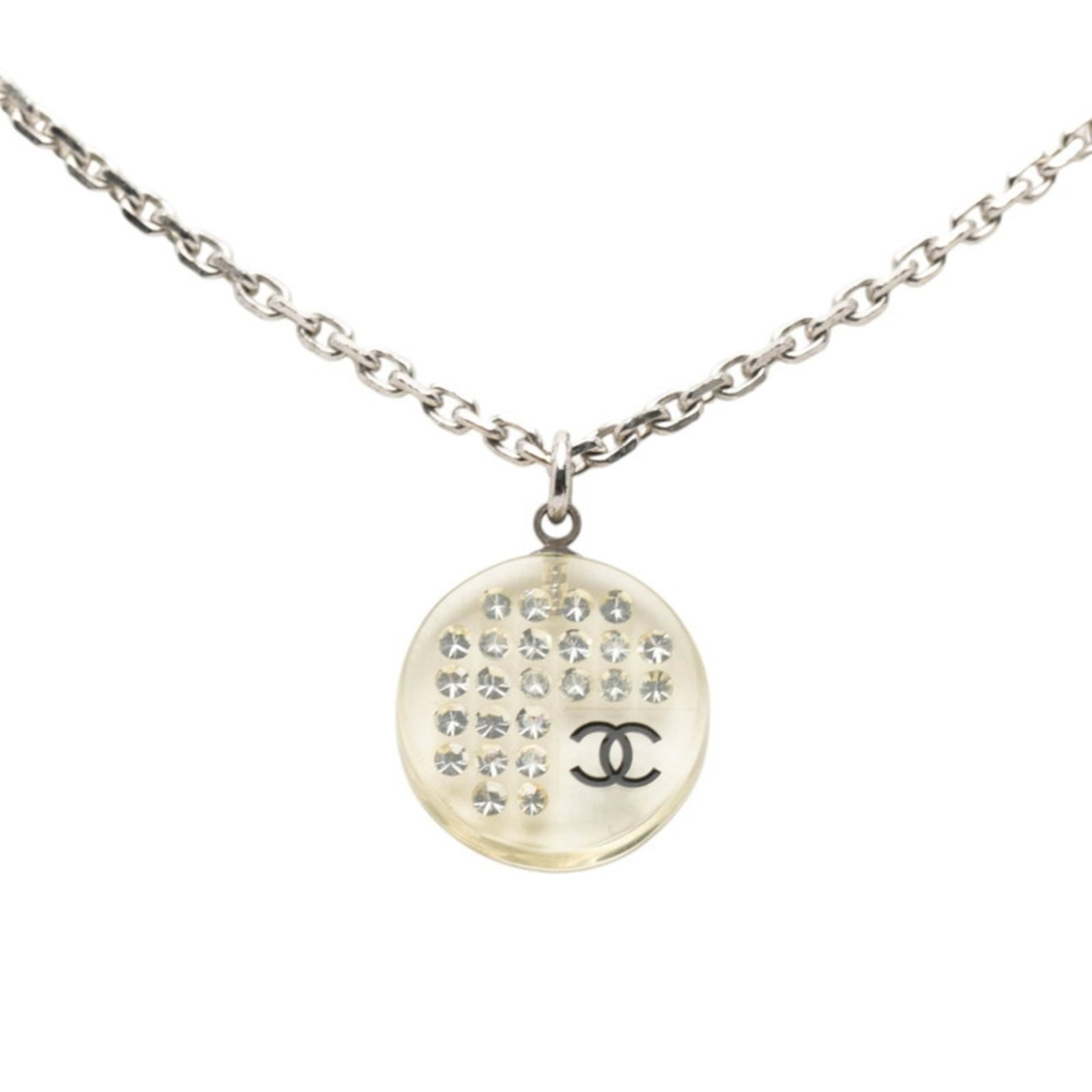 Coco Chanel Mark Necklace In Silver With Clear Metal Plastic Rhinestones: Coco Chanel Mark Necklace In Silver With Clear Metal Plastic Rhinestones Silver Coco Chanel Mark Necklace features clear metal plastic rhinestones, adding a touch of glamour to any outfit. The