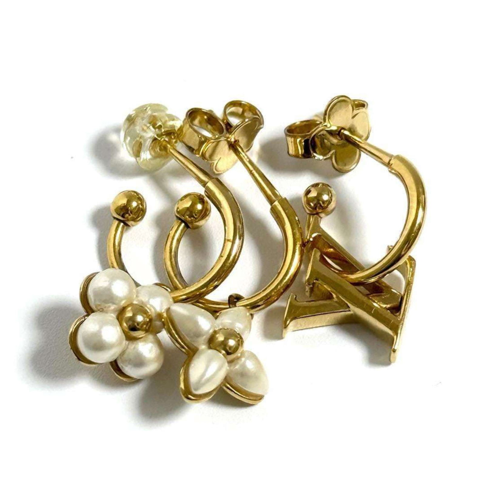 Louis Vuitton Hoop Earrings Artificial Pearl Metal: Louis Vuitton Hoop Earrings Artificial Pearl Metal Louis Vuitton's iconic Hoop Earrings feature artificial pearl accents and metal details, adding a touch of luxury to any outfit. With a few traces