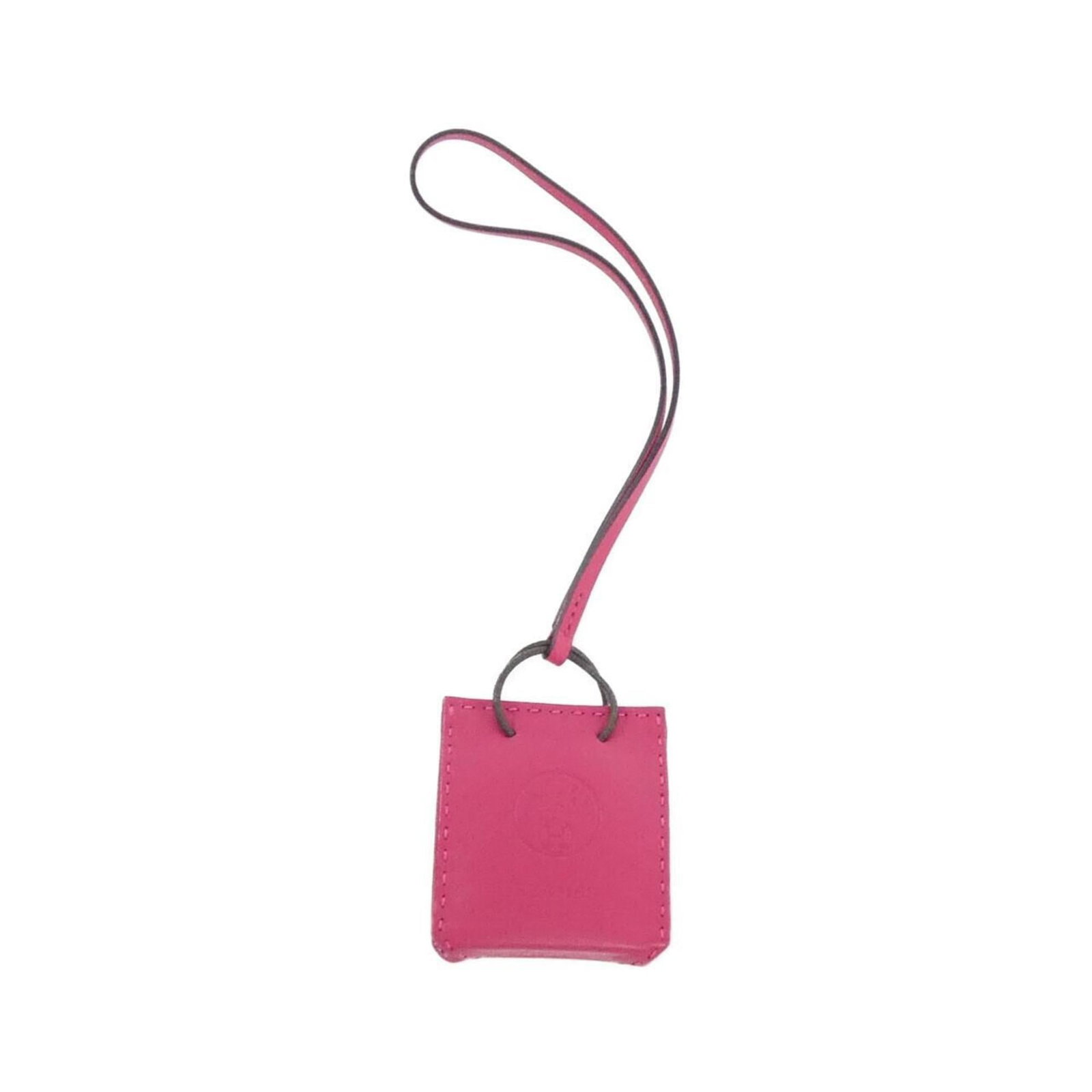 Hermes Handbag Charm Agneau Milo: Hermes Handbag Charm Agneau Milo Agneau Milo charm from Hermes, featuring a soft pink hue. This small, delicate charm measures just 6mm x 5mm x 2mm and is made from the luxurious Agneau Milo