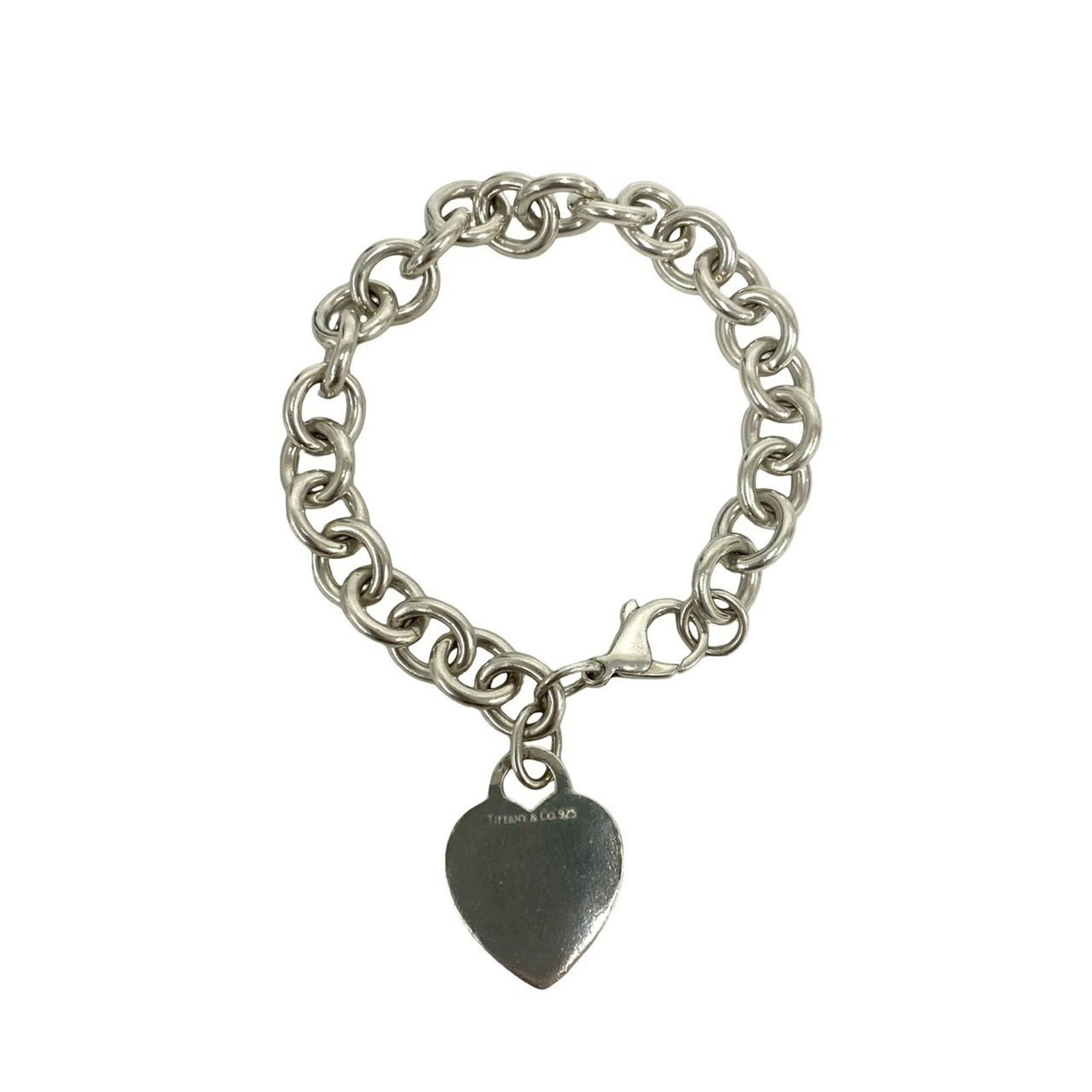 Charm Tiffany Bracelet 925 Silver: Charm Tiffany Bracelet 925 Silver Silver charm bracelet from Tiffany, featuring a classic design with a silver finish. The 19.5cm length provides a comfortable fit for everyday wear. With some signs o