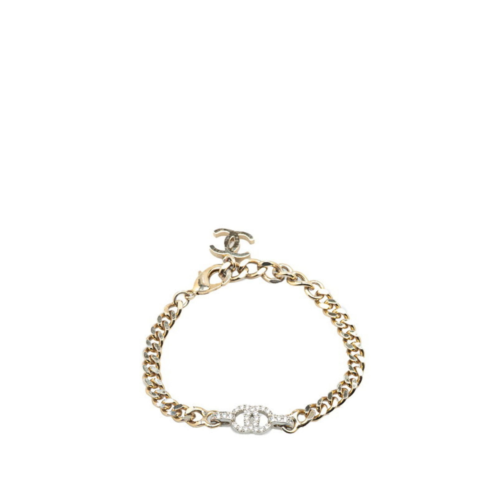Metal Charm Bracelet Chanel: Metal Charm Bracelet Chanel Silver metal charm bracelet from Chanel features rhinestone accents and measures 22.5cm in total length, with 19.5cm of chain and 3cm of charm attached. The bracelet has a 