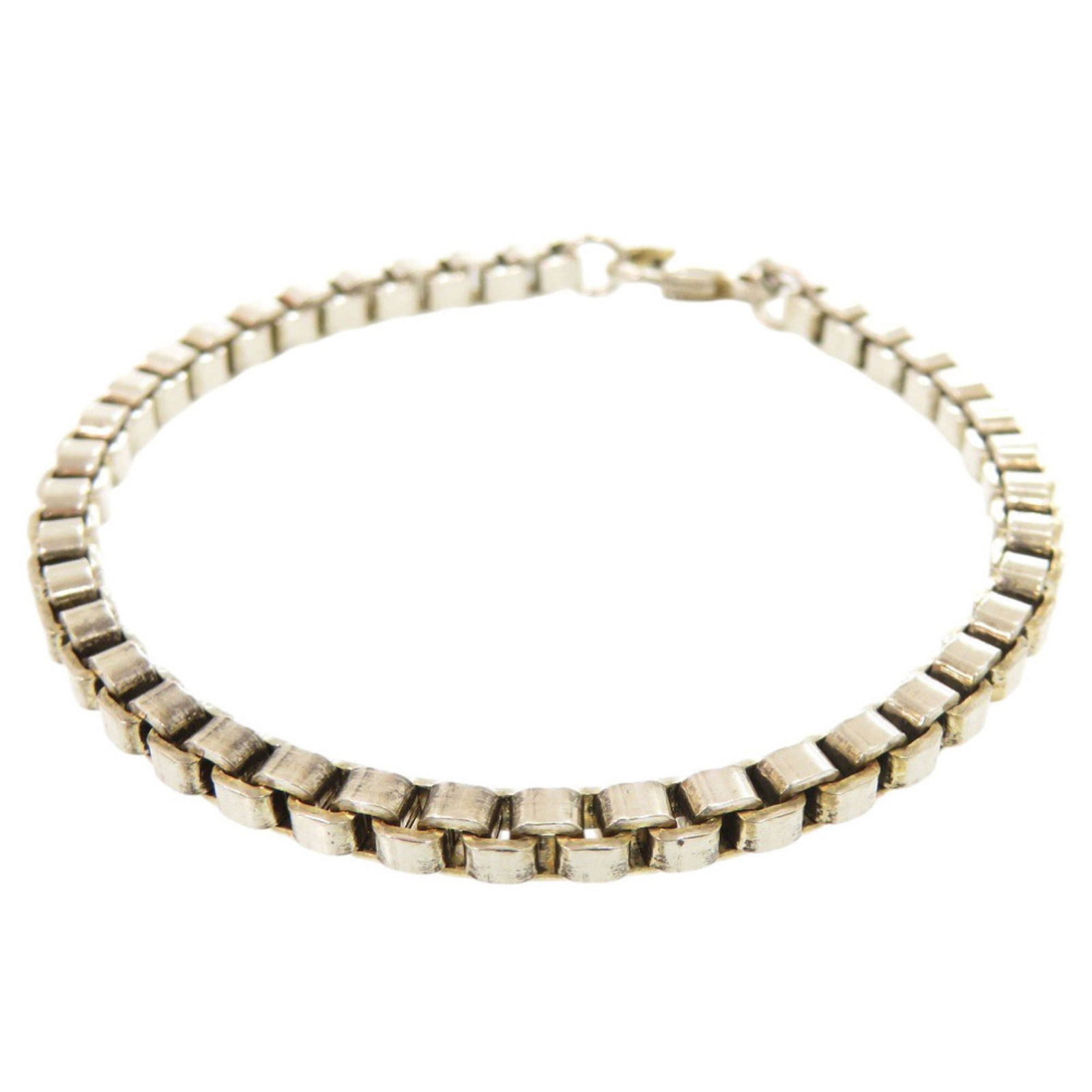 Charm Tiffany Bracelet 925 Silver: Charm Tiffany Bracelet 925 Silver Charm Tiffany Bracelet in 925 Silver. This used charm bracelet features silver 925 material and measures 18.5cm / 7.28'' in length, with a few traces of usage visible