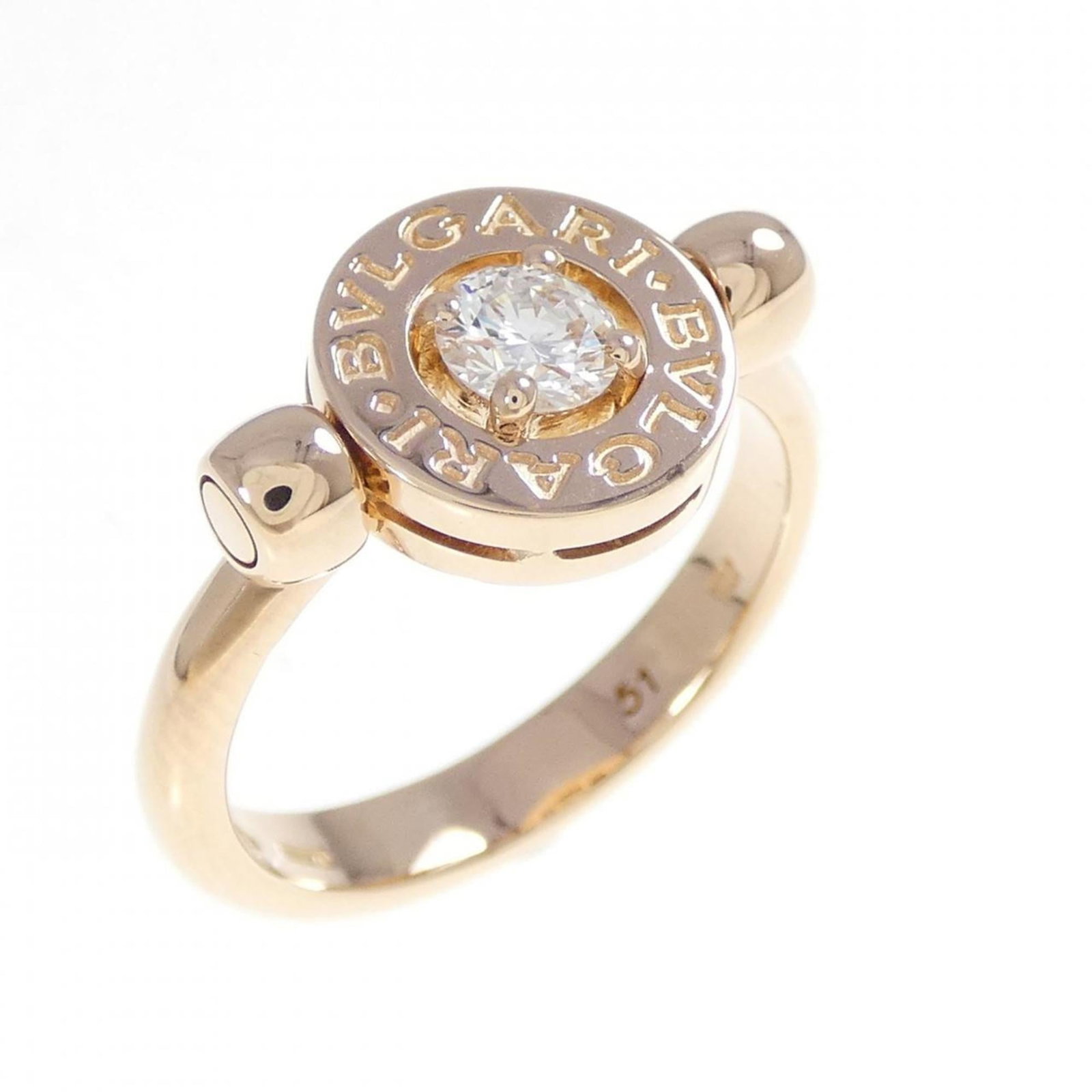 Bvlgari Ring: Bvlgari Ring Pink gold Bvlgari ring with a subtle pink hue, bearing a few traces of usage and minor scratches. The item's condition is described as very good, with some signs of wear visible. This