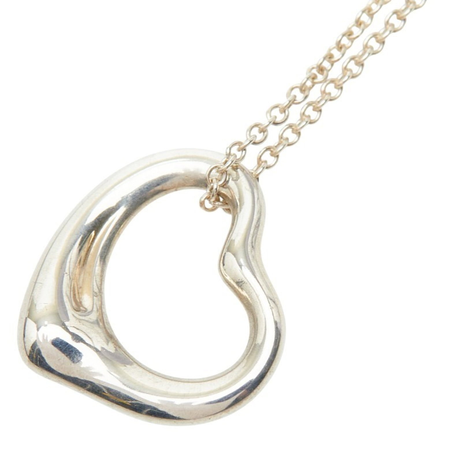Tiffany and Co open heart necklace women's silver Sv925.: Tiffany and Co open heart necklace women's silver Sv925. Tiffany and Co open heart necklace in sterling silver, featuring a 42 cm adjustable chain and a pendant measuring 14.6mm x 15.4mm. This piece