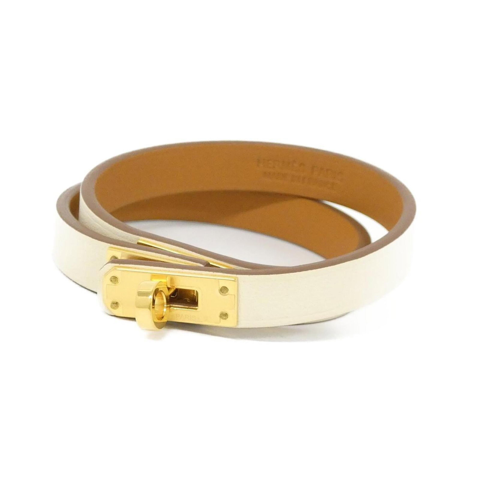 Hermes Leather Charm Swift Bracelet: Hermes Leather Charm Swift Bracelet Swift Leather Charm Bracelet in Gold and White, crafted by Hermes. This used charm bracelet features a few traces of usage, some scratches / dirt, but overall