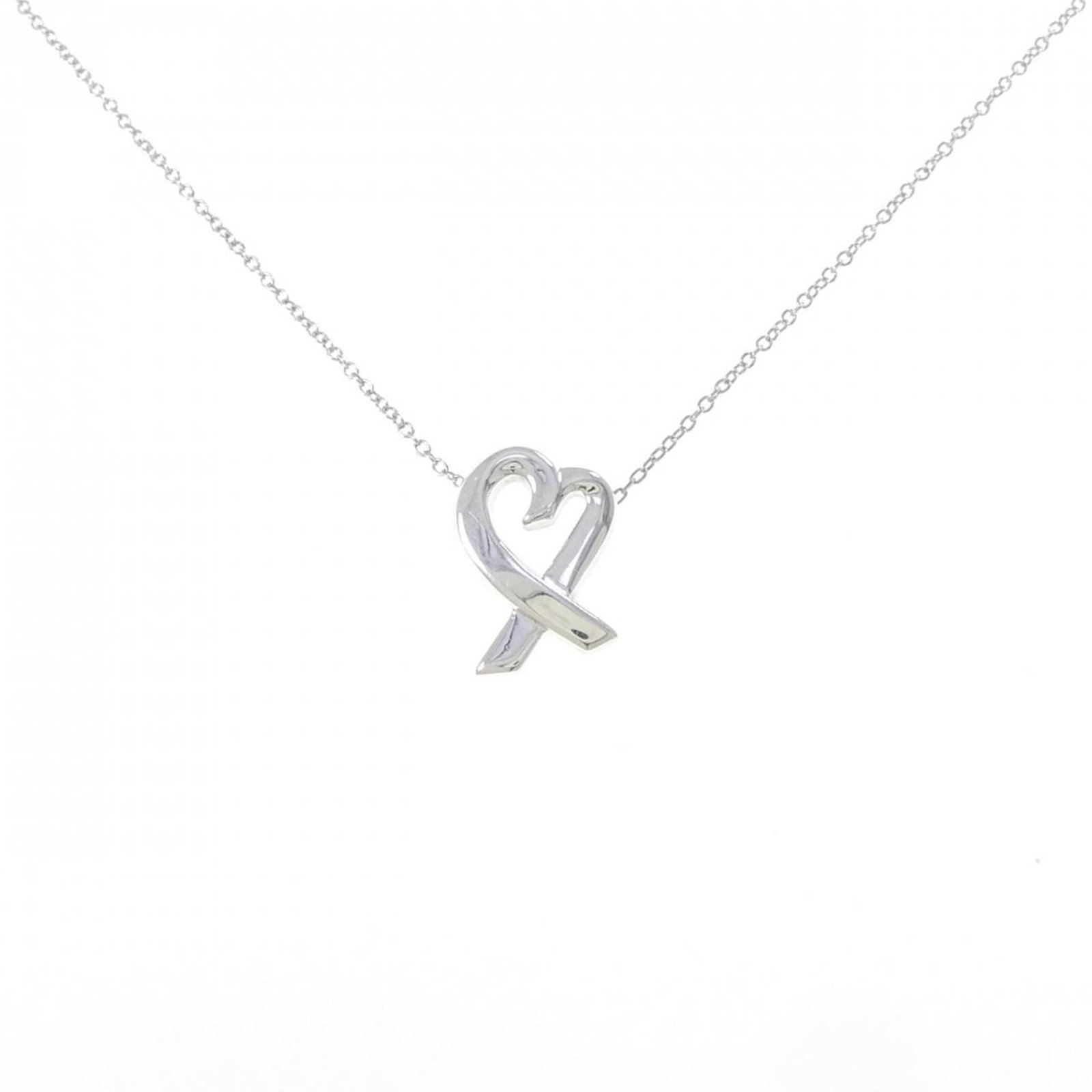 Small Loving Heart Necklace by Tiffany: Small Loving Heart Necklace by Tiffany Small Loving Heart Necklace by Tiffany features a delicate silver pendant with intricate details, measuring 14.9mm x 10.9mm and set in a sterling silver chain. T