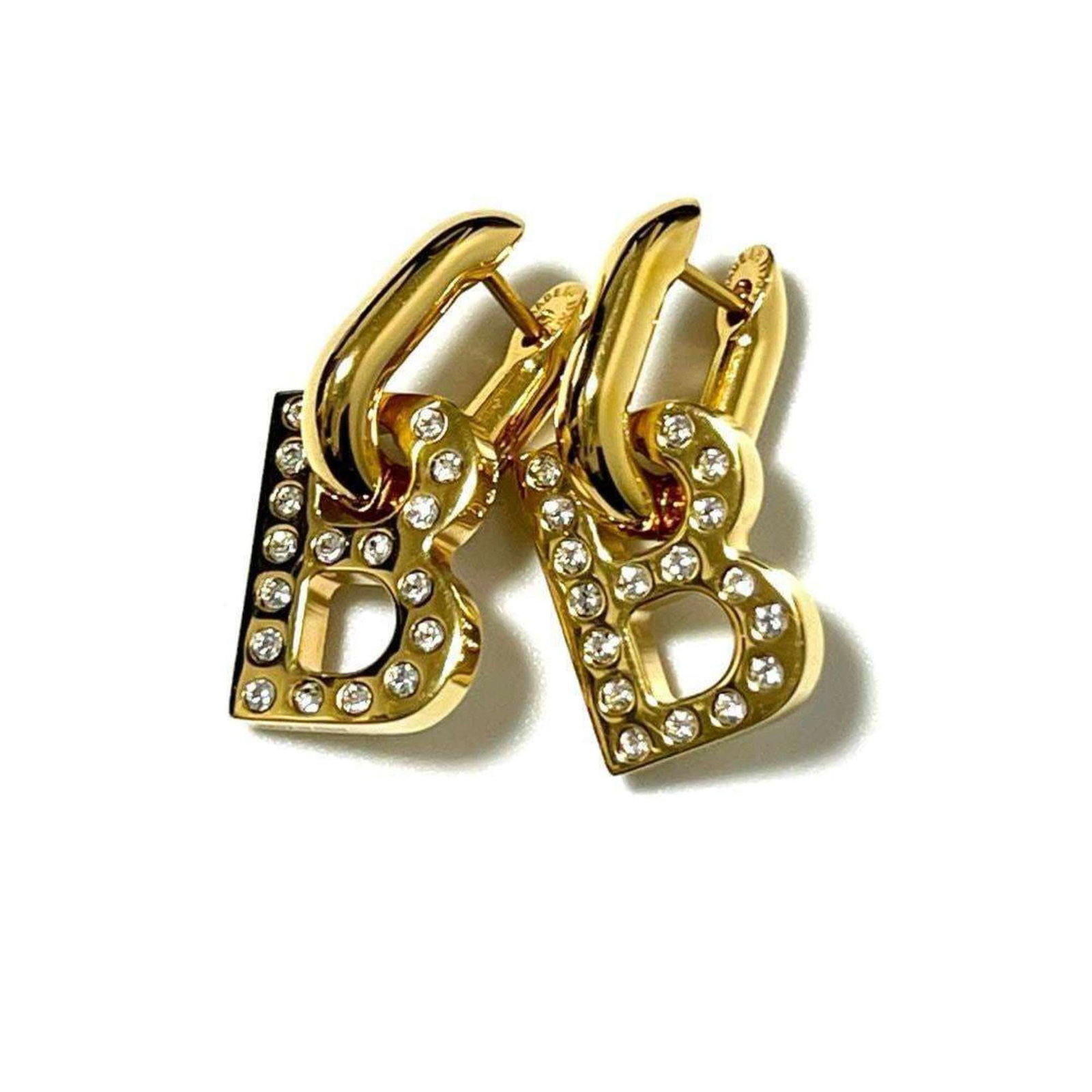 Earrings Drop Metal Balenciaga: Earrings Drop Metal Balenciaga Drop metal earrings from Balenciaga, featuring a gold finish with some scratches and dirt. The condition shows signs of usage, but overall the item remains in very good 