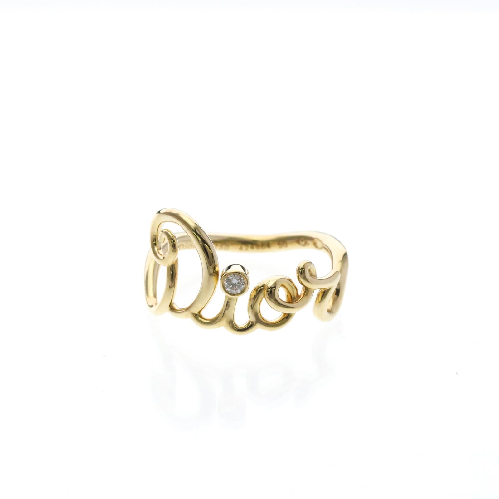 Christian Dior yellow gold band ring: Christian Dior yellow gold band ring Yellow gold band ring from Christian Dior, featuring a 10.00mm diamond stone set in an 18K yellow gold band with a width of 1.7mm. The ring bears some scratches an