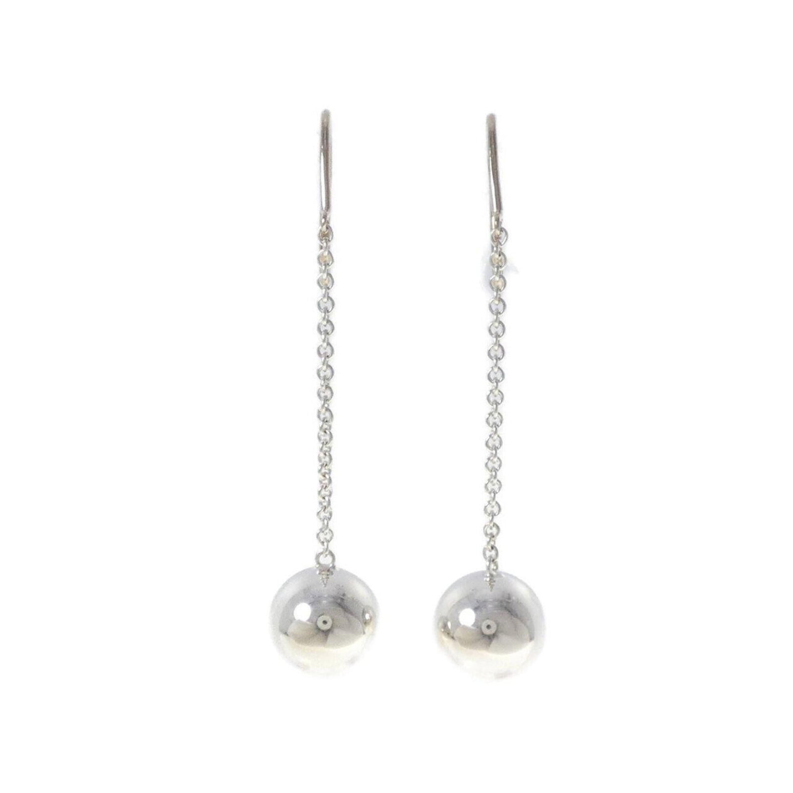 Silver 925 stud earrings by Tiffany: Silver 925 stud earrings by Tiffany Silver 925 stud earrings by Tiffany, featuring a classic design with a subtle shine from the high-quality silver material. The earrings have some minor scratches an