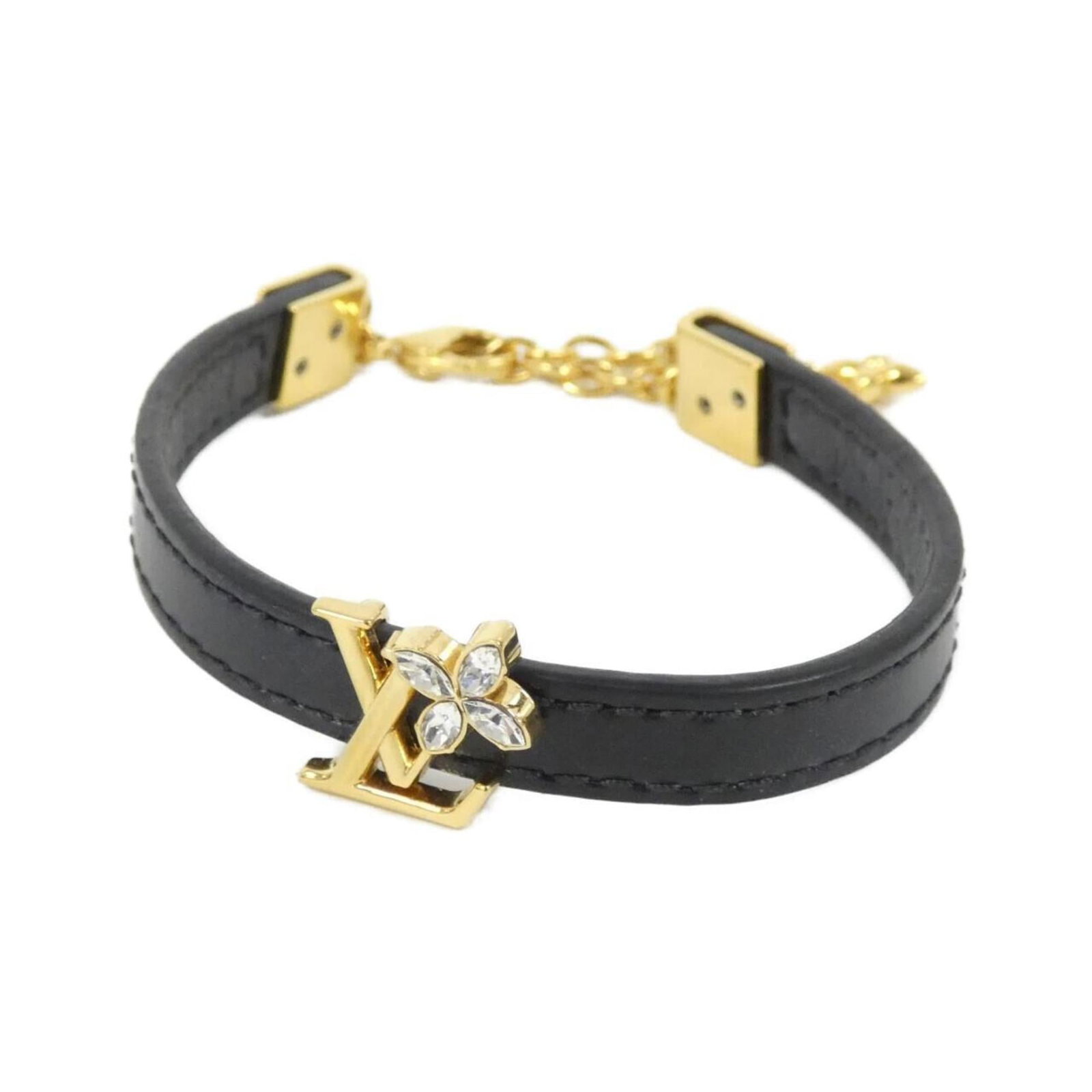 Vuitton Louis Charm Bracelet: Vuitton Louis Charm Bracelet Black Louis Vuitton charm bracelet with a length of 19.5cm and a width of 8mm, featuring some scratches and dirt that add to its worn-in look. This used charm bracelet is 