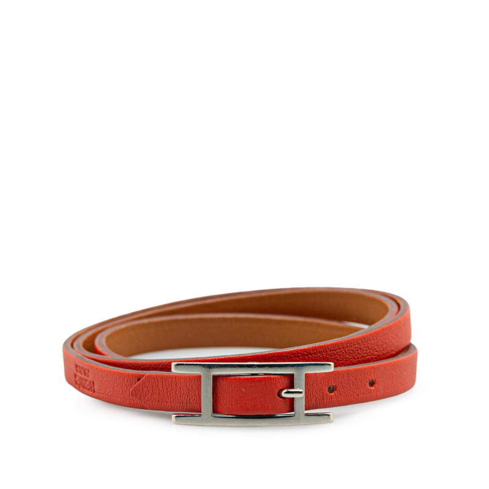 Hermes Leather Charm Swift Bracelet: Hermes Leather Charm Swift Bracelet Swift leather charm bracelet from Hermes, featuring a classic design with a brown and orange color combination. The bracelet has some minor scratches and dirt, but 
