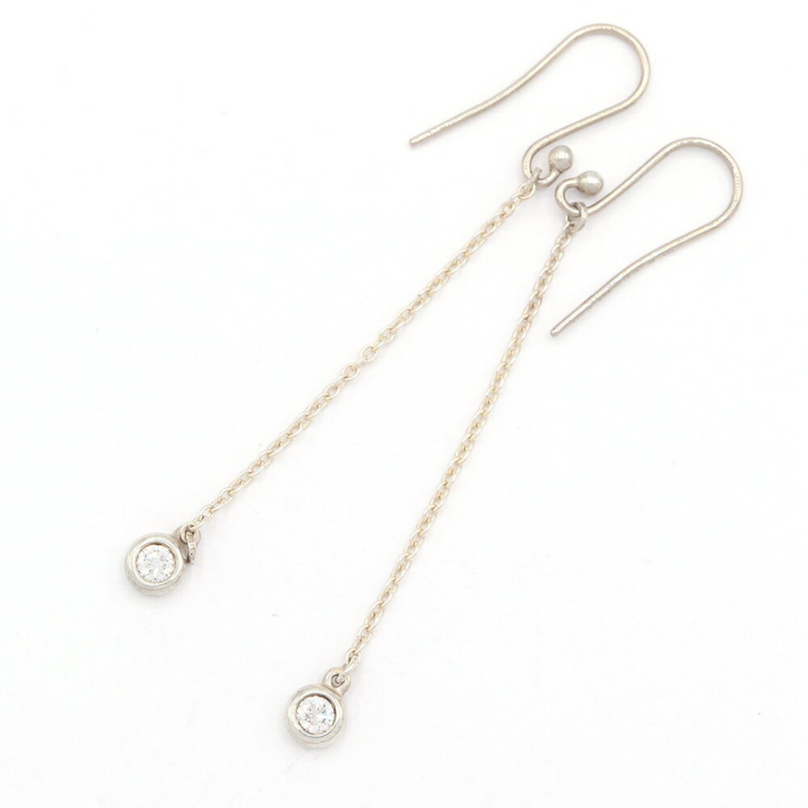 Sterling Silver Stud Earrings by Tiffany: Sterling Silver Stud Earrings by Tiffany Sterling Silver Stud Earrings by Tiffany are made from high-quality sterling silver, with a few traces of usage visible. The earrings have some minor