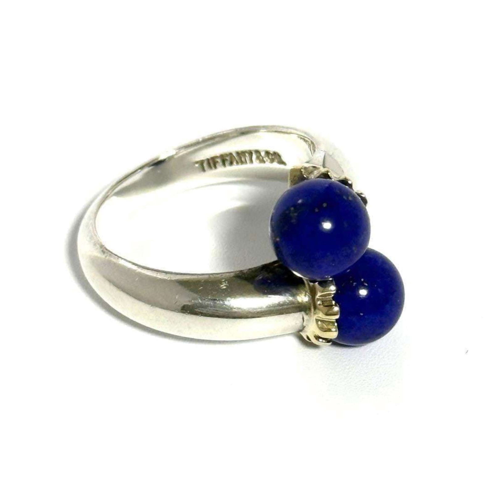 Tiffany Band Ring Silver 925 Yellow Gold (18K): Tiffany Band Ring Silver 925 Yellow Gold (18K) Silver 925, Yellow Gold (18K) Tiffany Band Ring with Lapis Lazuli Stone features a classic design. The ring bears a signature and is made from high-quali