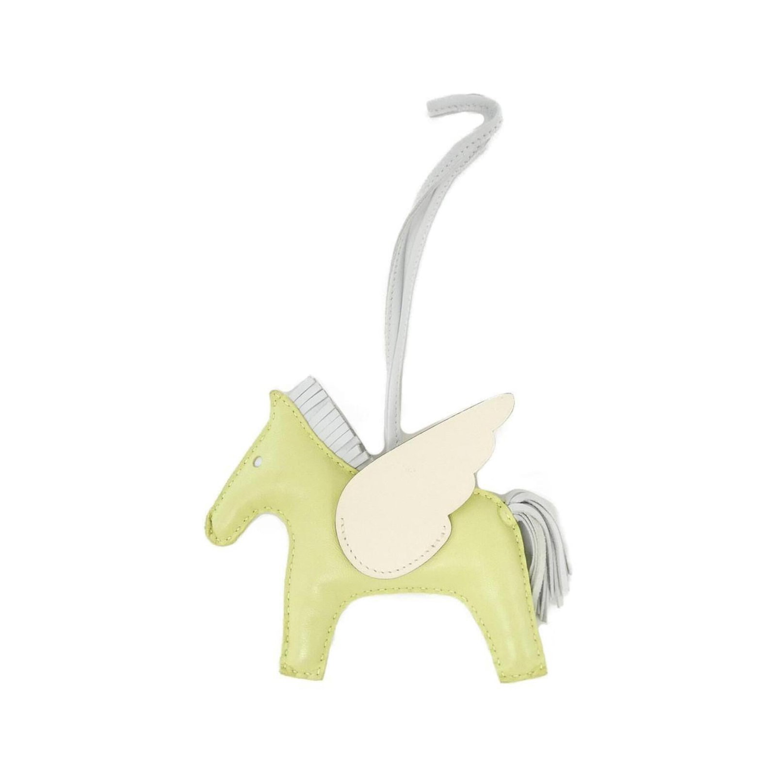 Hermes Handbag Charm Agneau Milo: Hermes Handbag Charm Agneau Milo Agneau Milo Handbag Charm from Hermes features a striking green color. Made from Agneau Milo, a material known for its unique properties, this charm showcases the