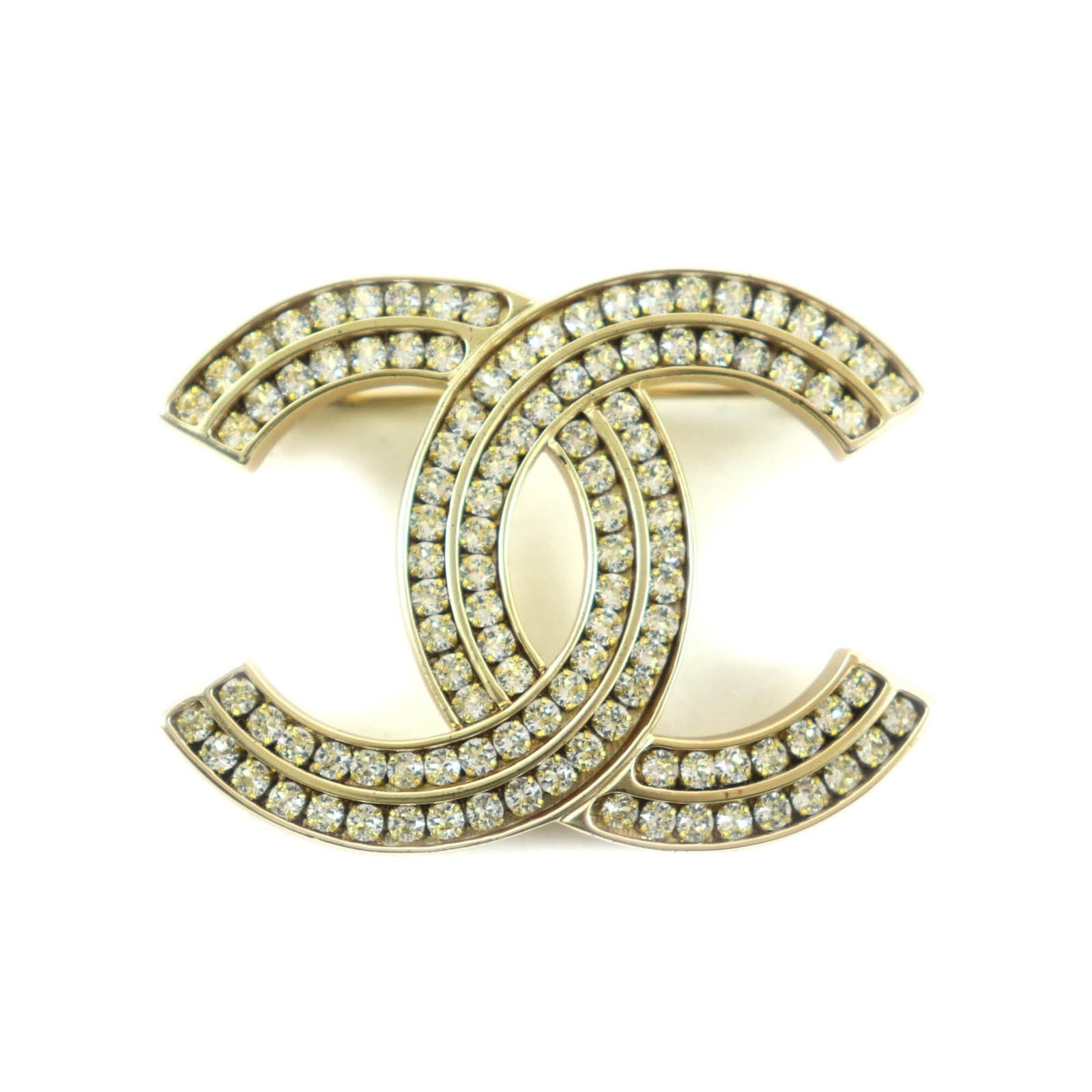 Chanel Brooch: Chanel Brooch Gold Chanel brooch, measuring 3.5cm x 5cm, bears a signature and is in mint condition, like new. This elegant piece features the iconic Chanel brand. A beautiful addition to any collecti